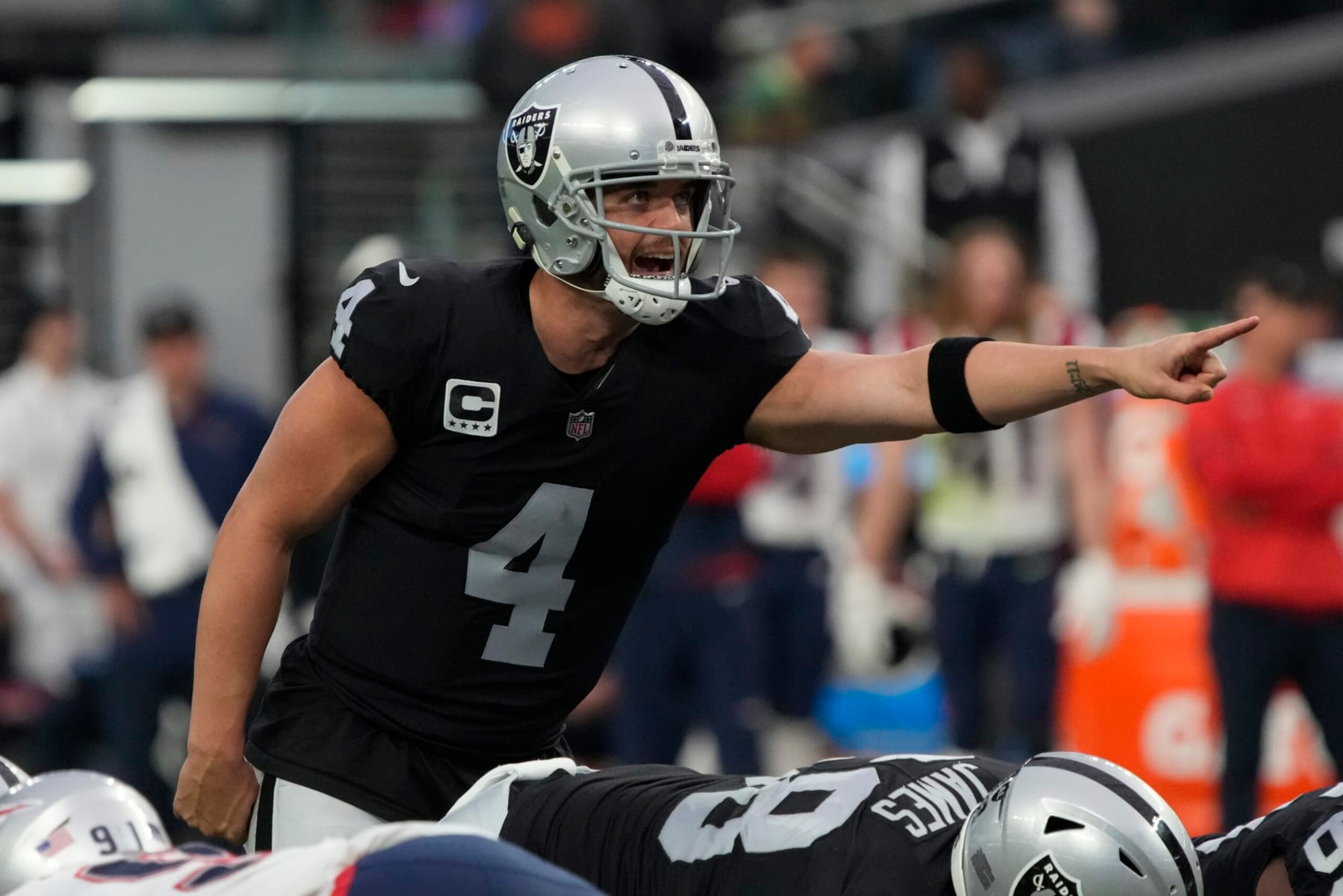 Las Vegas Raiders quarterback Derek Carr (4) lines up against the New England Patriots during the first half of an NFL football game, Sunday, Dec. 18, 2022, in Las Vegas. (AP Photo/Rick Scuteri)
