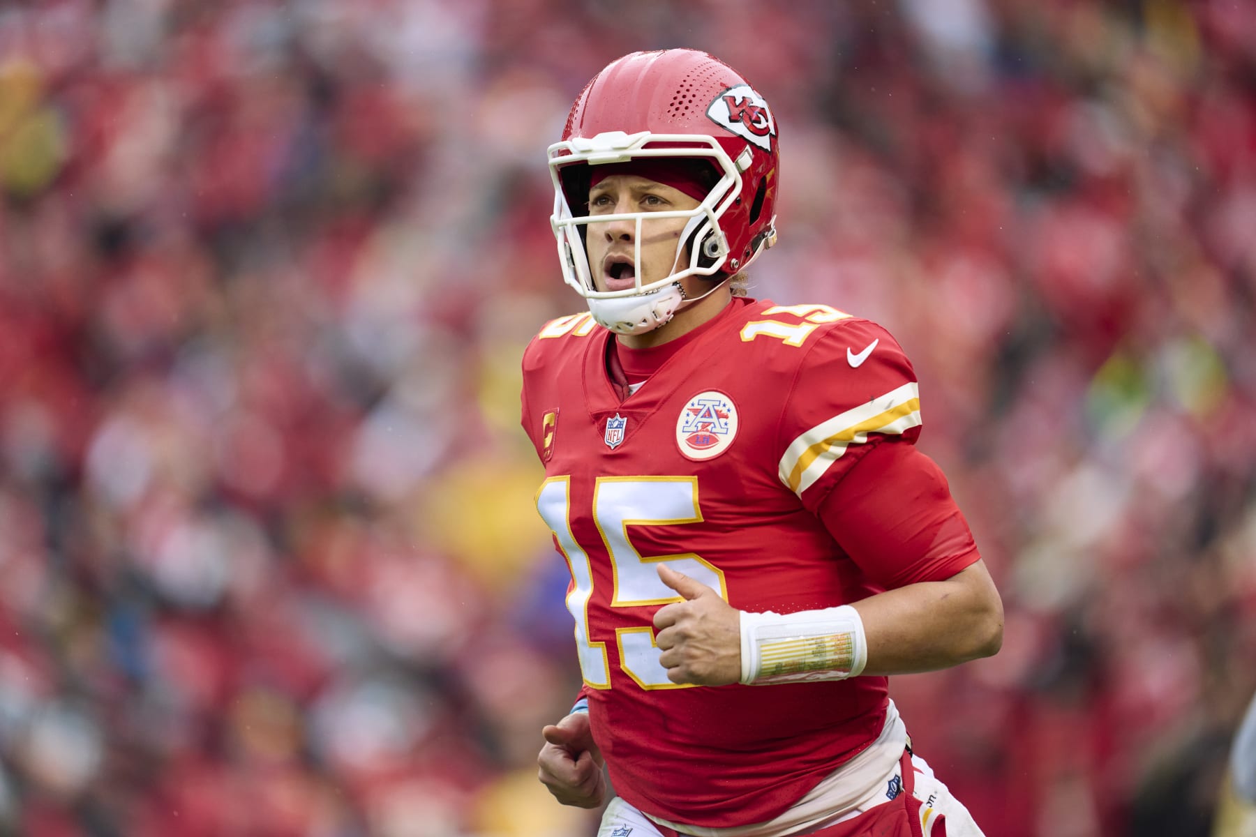 KANSAS CITY, MO - JANUARY 21: Patrick Mahomes #15 of the Kansas City Chiefs jogs towards the sideline against the Jacksonville Jaguars during the first half at GEHA Field at Arrowhead Stadium on January 21, 2023 in Kansas City, Missouri. (Photo by Cooper Neill/Getty Images)