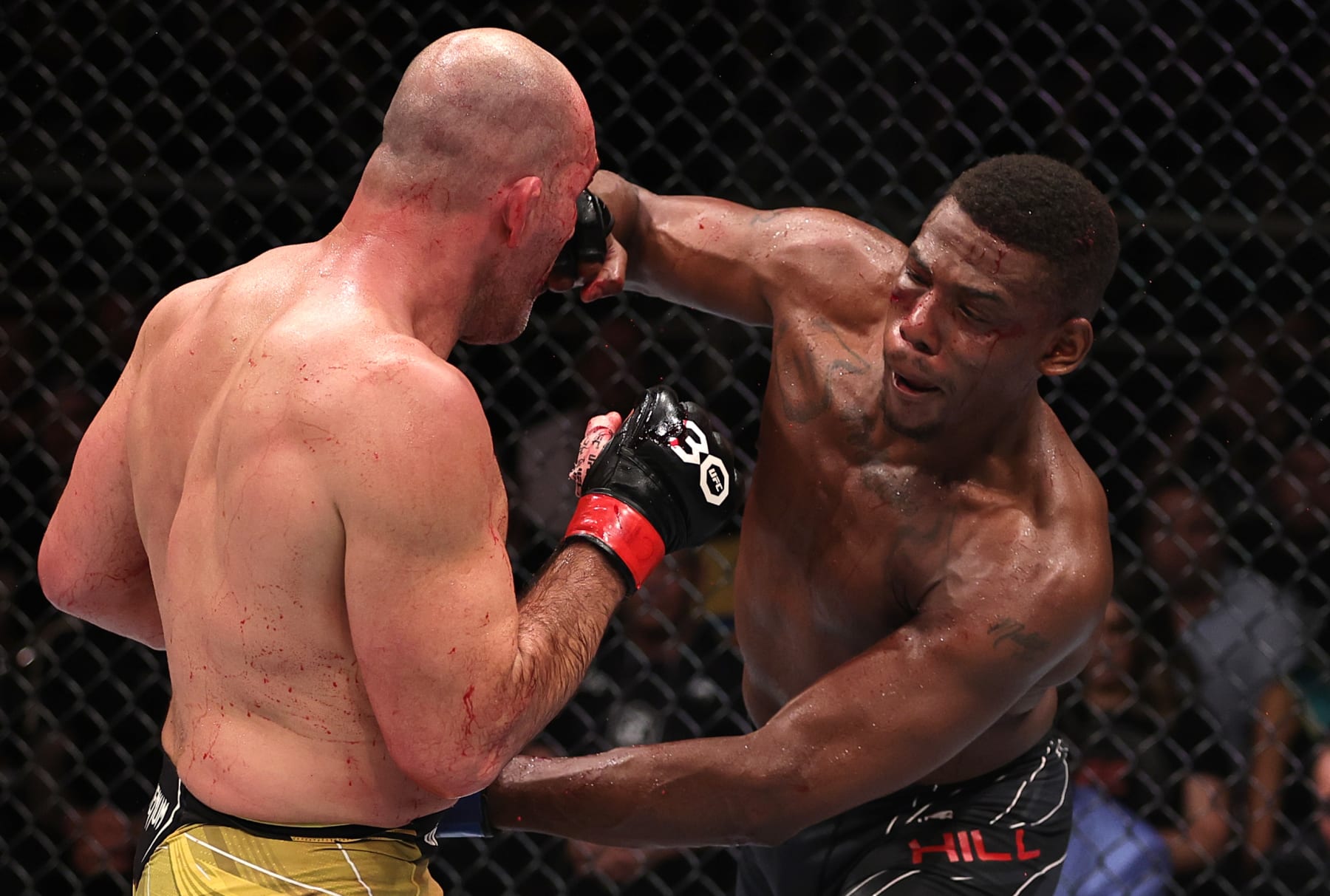 RIO DE JANEIRO, BRAZIL - JANUARY 21: (R-L) Jamahal Hill punches Glover Teixeira of Brazil in the UFC light heavyweight championship fight during the UFC 283 event at Jeunesse Arena on January 21, 2023 in Rio de Janeiro, Brazil. (Photo by Buda Mendes/Zuffa LLC via Getty Images)