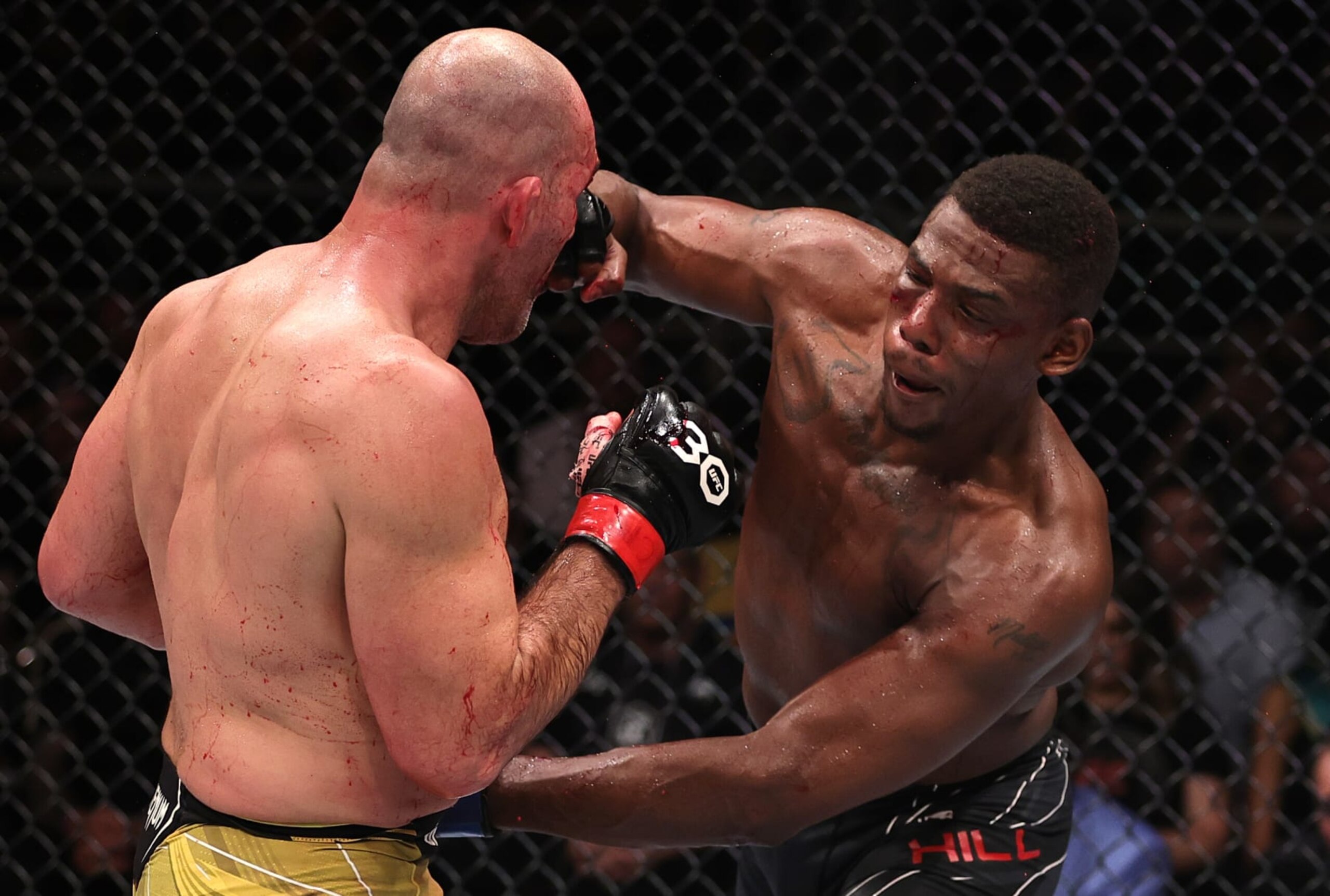 RIO DE JANEIRO, BRAZIL - JANUARY 21: (R-L) Jamahal Hill punches Glover Teixeira of Brazil in the UFC light heavyweight championship fight during the UFC 283 event at Jeunesse Arena on January 21, 2023 in Rio de Janeiro, Brazil. (Photo by Buda Mendes/Zuffa LLC via Getty Images)