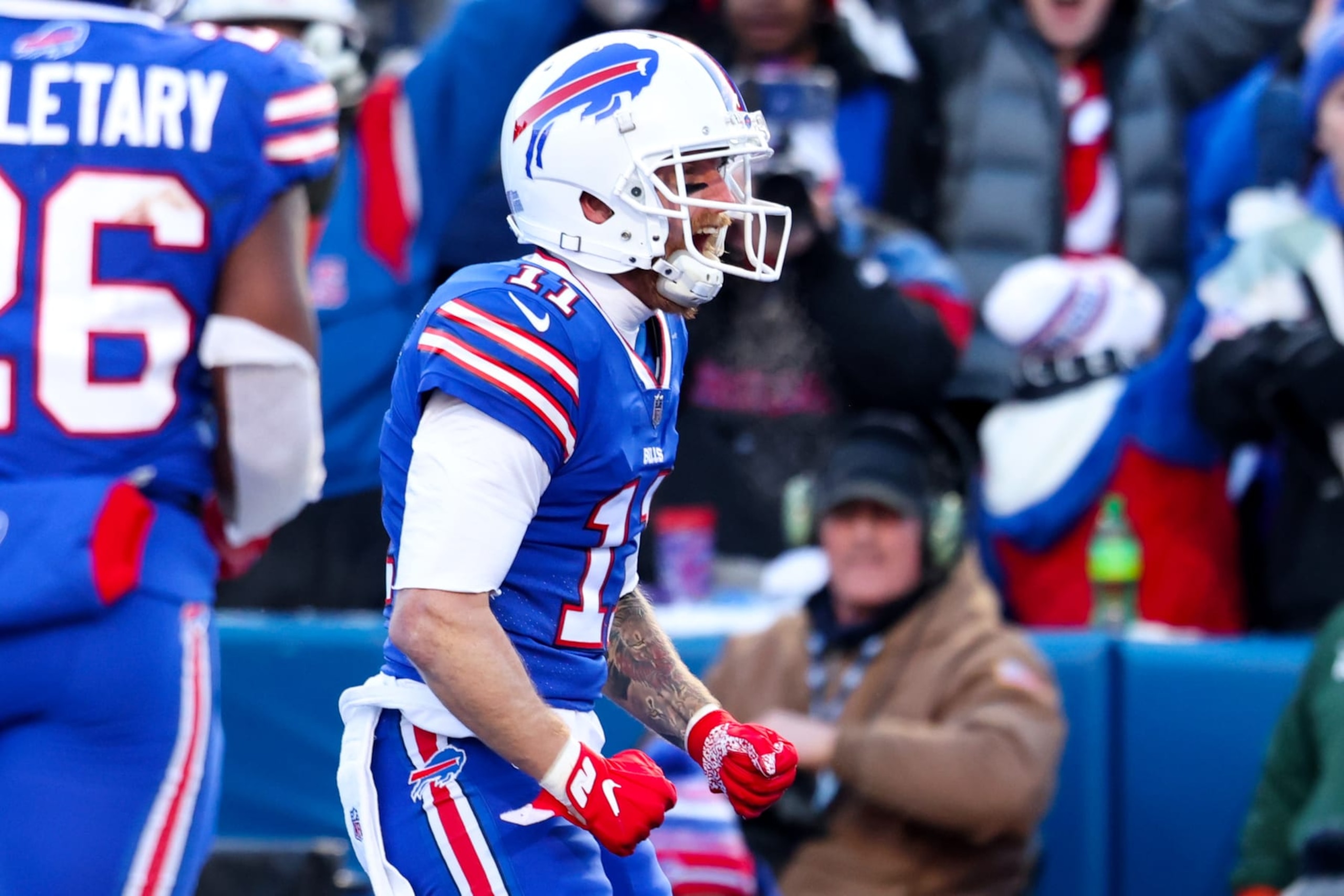 ORCHARD PARK, NEW YORK - JANUARY 15: Cole Beasley #11 of the Buffalo Bills celebrates after scoring a touchdown against the Miami Dolphins during the third quarter of the game in the AFC Wild Card playoff game at Highmark Stadium on January 15, 2023 in Orchard Park, New York. (Photo by Bryan M. Bennett/Getty Images)