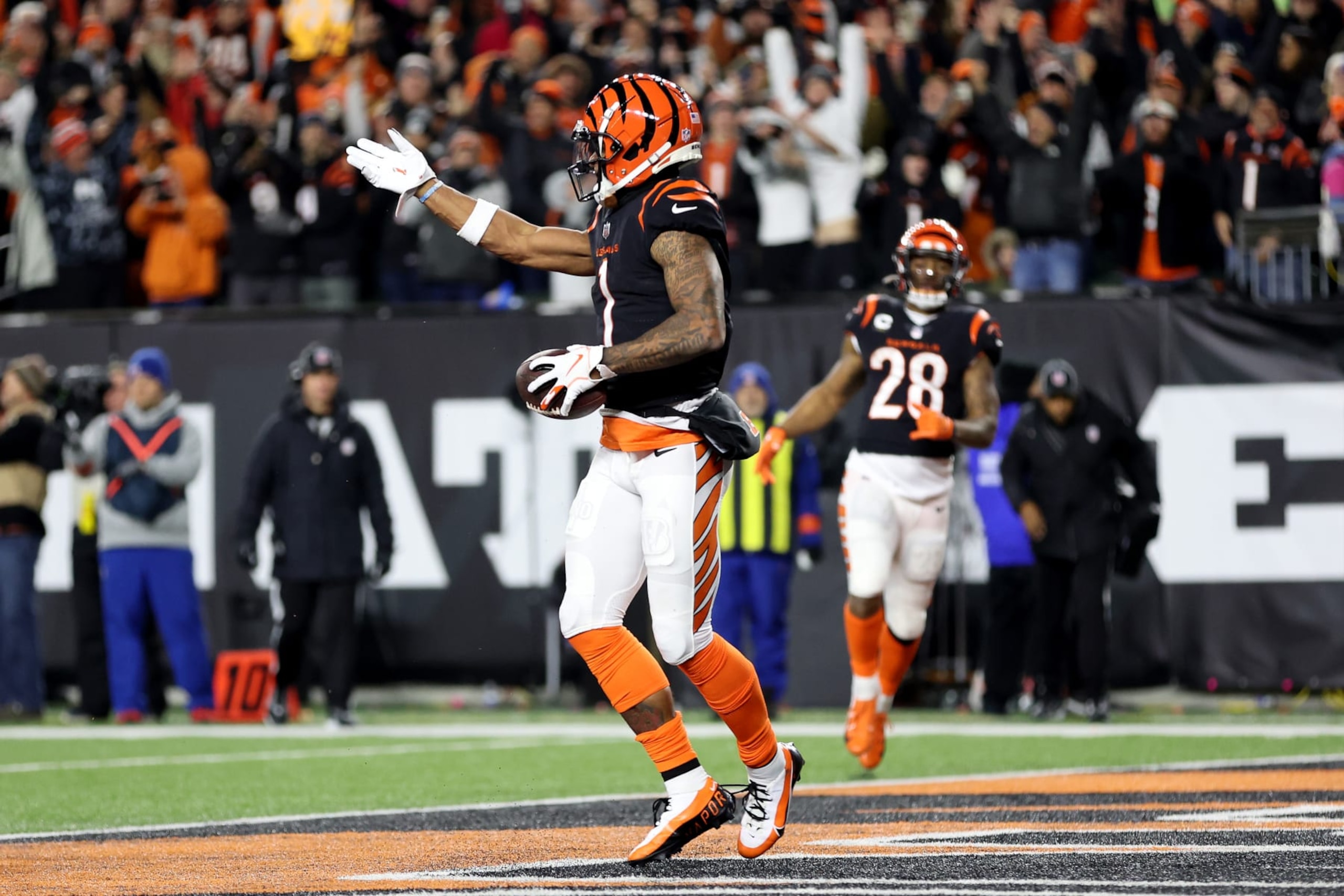 CINCINNATI, OHIO - JANUARY 15: Ja'Marr Chase #1 of the Cincinnati Bengals celebrates after scoring a 7 yard touchdown against the Baltimore Ravens during the second quarter in the AFC Wild Card playoff game at Paycor Stadium on January 15, 2023 in Cincinnati, Ohio. (Photo by Rob Carr/Getty Images)