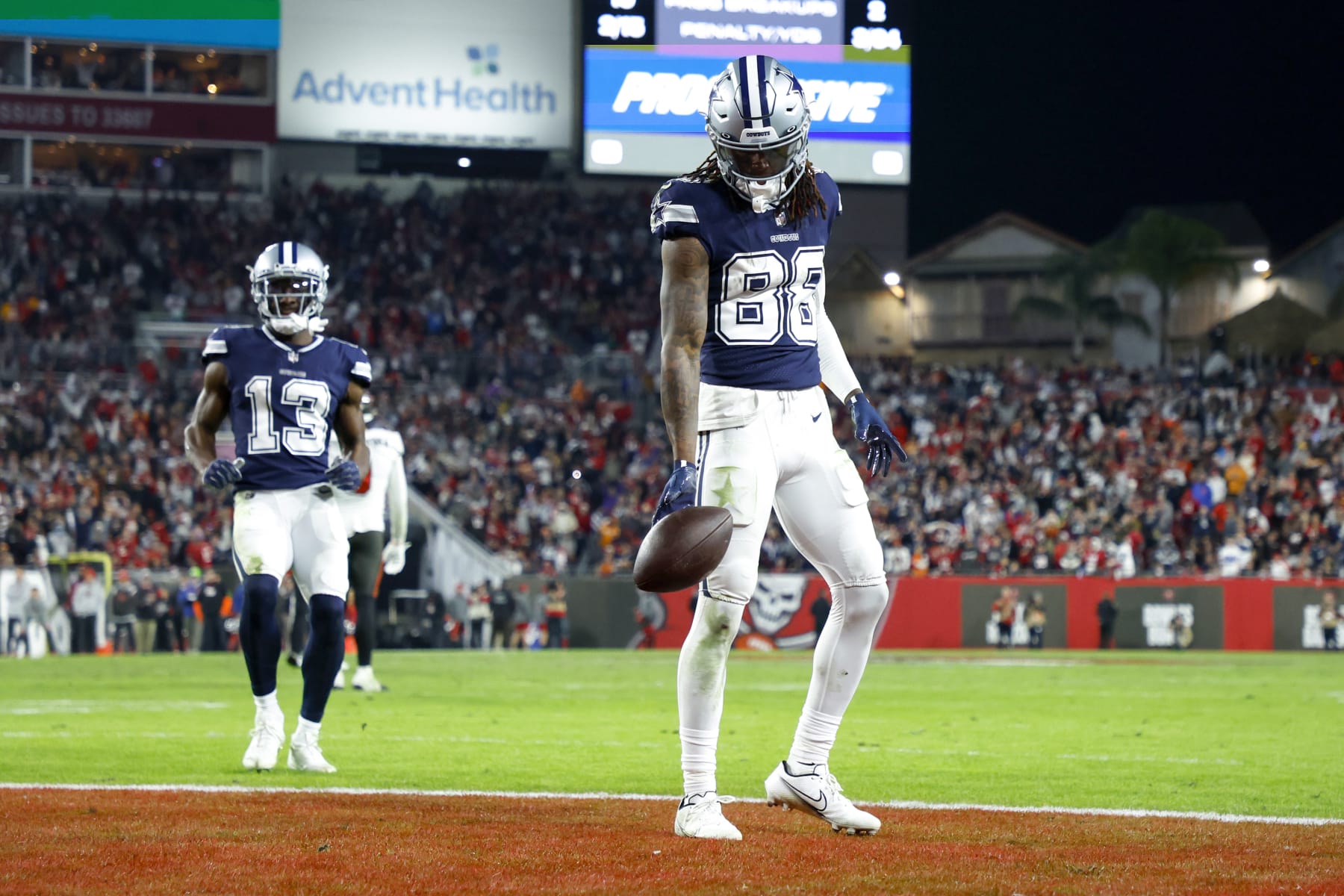 TAMPA, FLORIDA - JANUARY 16: CeeDee Lamb #88 of the Dallas Cowboys celebrates after scoring a touchdown against the Tampa Bay Buccaneers during the fourth quarter in the NFC Wild Card playoff game at Raymond James Stadium on January 16, 2023 in Tampa, Florida. (Photo by Mike Ehrmann/Getty Images)