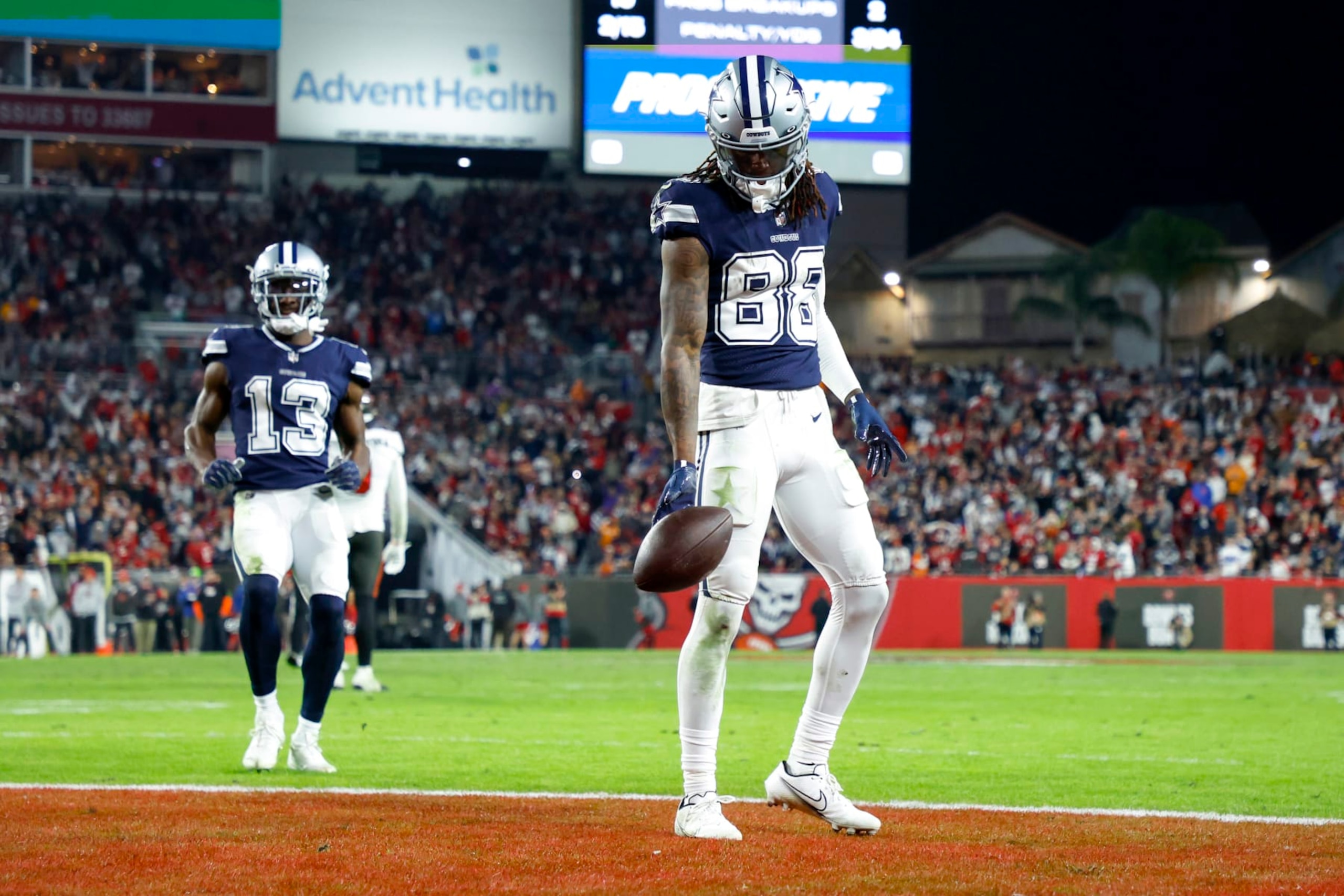 TAMPA, FLORIDA - JANUARY 16: CeeDee Lamb #88 of the Dallas Cowboys celebrates after scoring a touchdown against the Tampa Bay Buccaneers during the fourth quarter in the NFC Wild Card playoff game at Raymond James Stadium on January 16, 2023 in Tampa, Florida. (Photo by Mike Ehrmann/Getty Images)