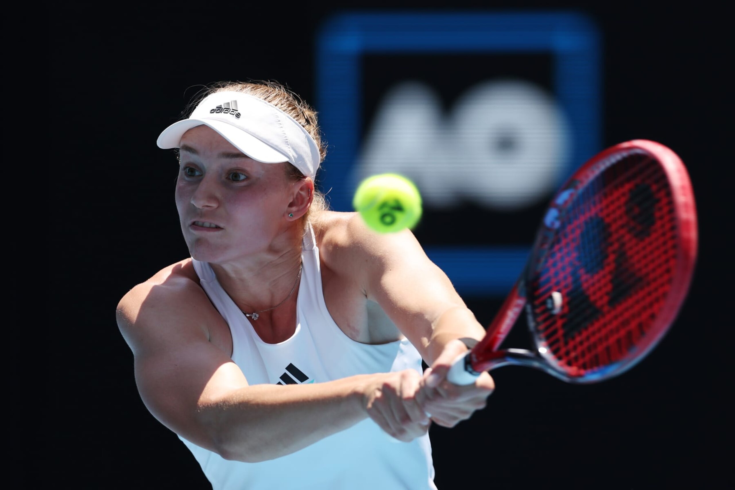 MELBOURNE, AUSTRALIA - JANUARY 22: Elena Rybakina of Kazakhstan plays a backhand during the fourth round singles match against Iga Swiatek of Poland during day seven of the 2023 Australian Open at Melbourne Park on January 22, 2023 in Melbourne, Australia. (Photo by Clive Brunskill/Getty Images)