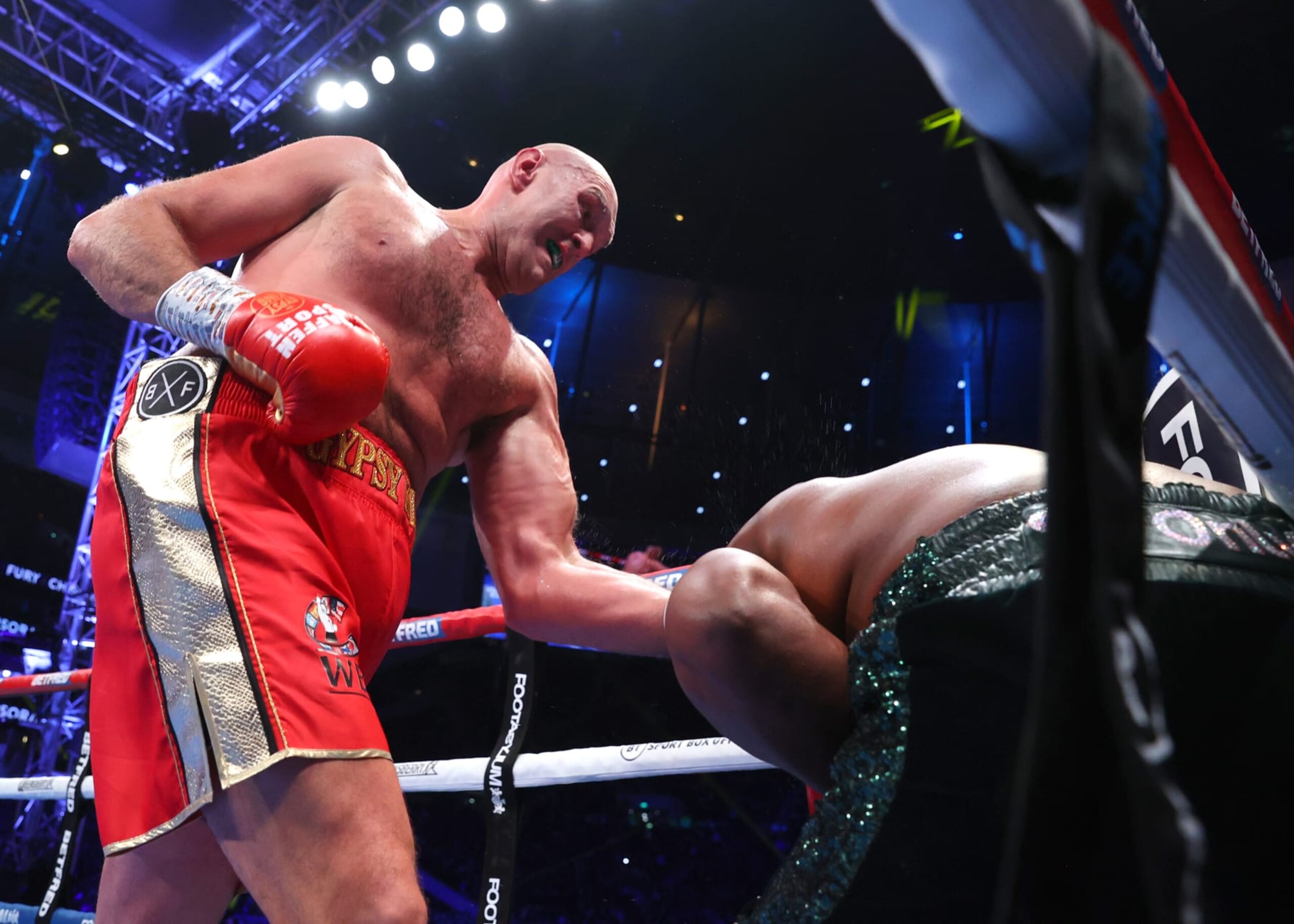 LONDON, ENGLAND - DECEMBER 03: Tyson Fury (L) and Derek Chisora (R) exchange punches during their WBC heavyweight championship fight, at Tottenham Hotspur Stadium on December 03, 2022 in London, England. (Photo by Mikey Williams/Top Rank Inc via Getty Images)