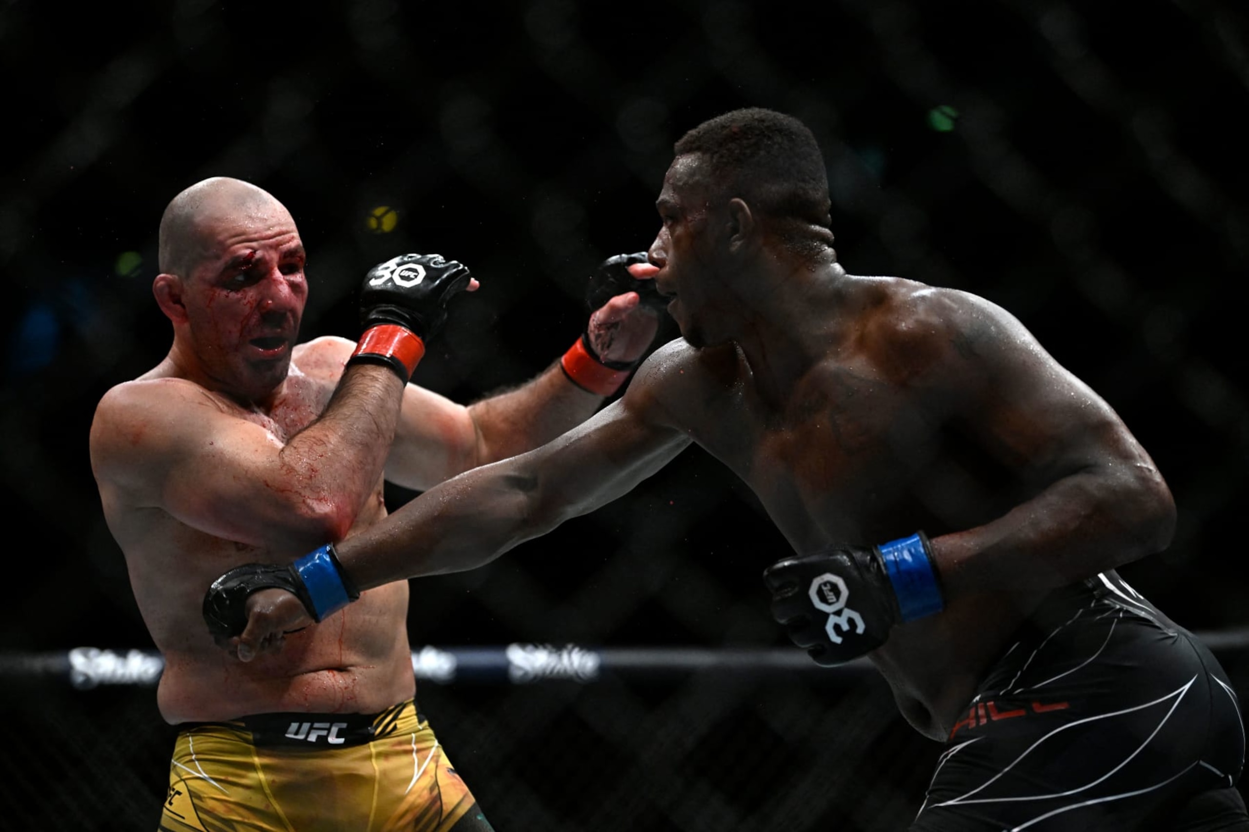 Brazilian Glover Teixera (L) competes against US Jamahal Hill during their light heavyweight title bout at the Ultimate Fighting Championship (UFC) event at the Jeunesse Arena in Rio de Janeiro, Brazil, on January 21, 2023. (Photo by MAURO PIMENTEL / AFP) (Photo by MAURO PIMENTEL/AFP via Getty Images)