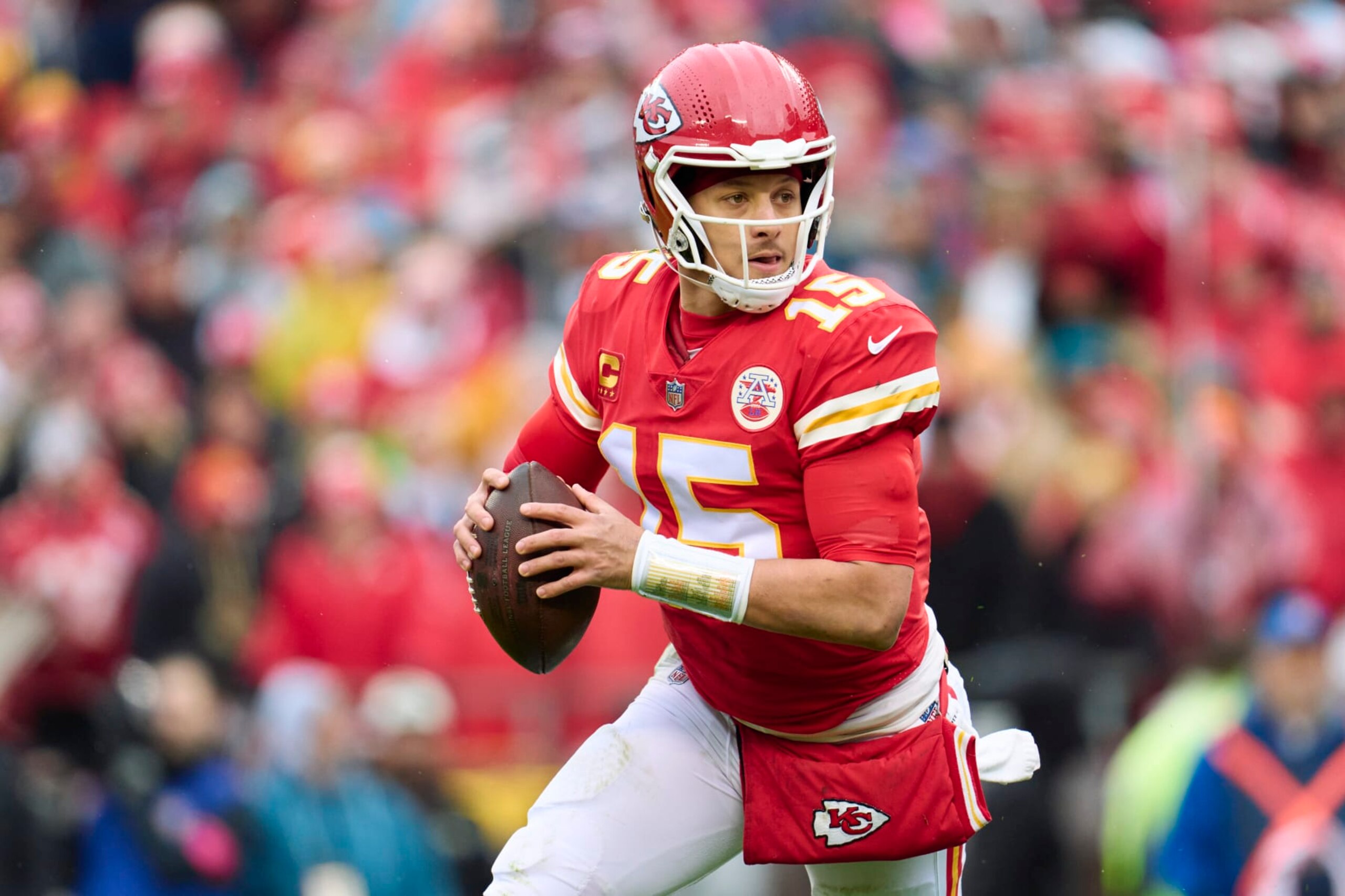 KANSAS CITY, MO - JANUARY 21: Patrick Mahomes #15 of the Kansas City Chiefs drops back to pass against the Jacksonville Jaguars during the first half at GEHA Field at Arrowhead Stadium on January 21, 2023 in Kansas City, Missouri. (Photo by Cooper Neill/Getty Images)
