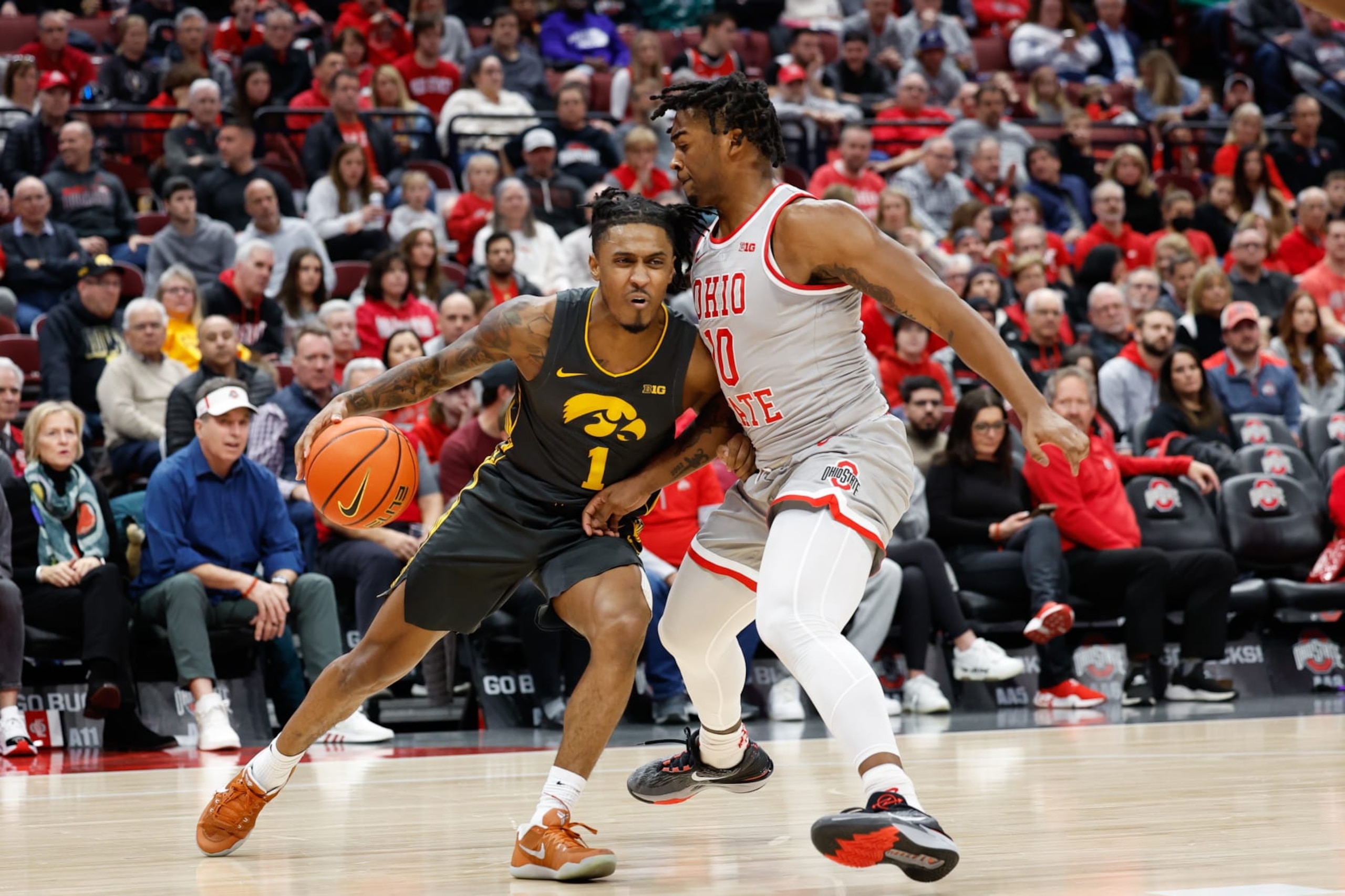 Ohio State's Brice Sensabaugh and Iowa's Ahron Ulis Ohio State's Brice Sensabaugh and Iowa's Ahron Ulis