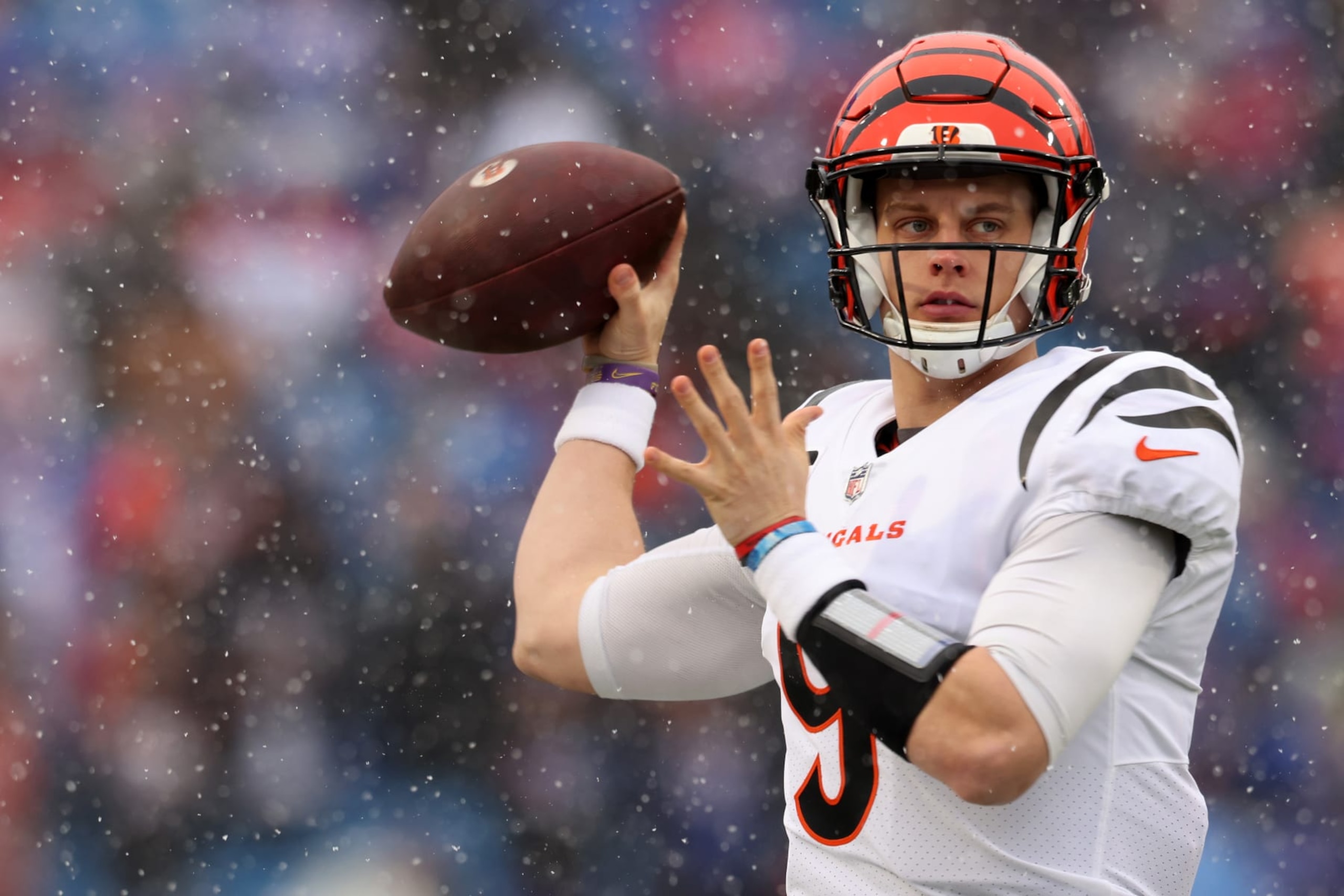 ORCHARD PARK, NEW YORK - JANUARY 22: Joe Burrow #9 of the Cincinnati Bengals warms up prior to the AFC Divisional Playoff game against the Buffalo Bills at Highmark Stadium on January 22, 2023 in Orchard Park, New York. (Photo by Bryan M. Bennett/Getty Images) ORCHARD PARK, NEW YORK - JANUARY 22: Joe Burrow #9 of the Cincinnati Bengals warms up prior to the AFC Divisional Playoff game against the Buffalo Bills at Highmark Stadium on January 22, 2023 in Orchard Park, New York. (Photo by Bryan M. Bennett/Getty Images)