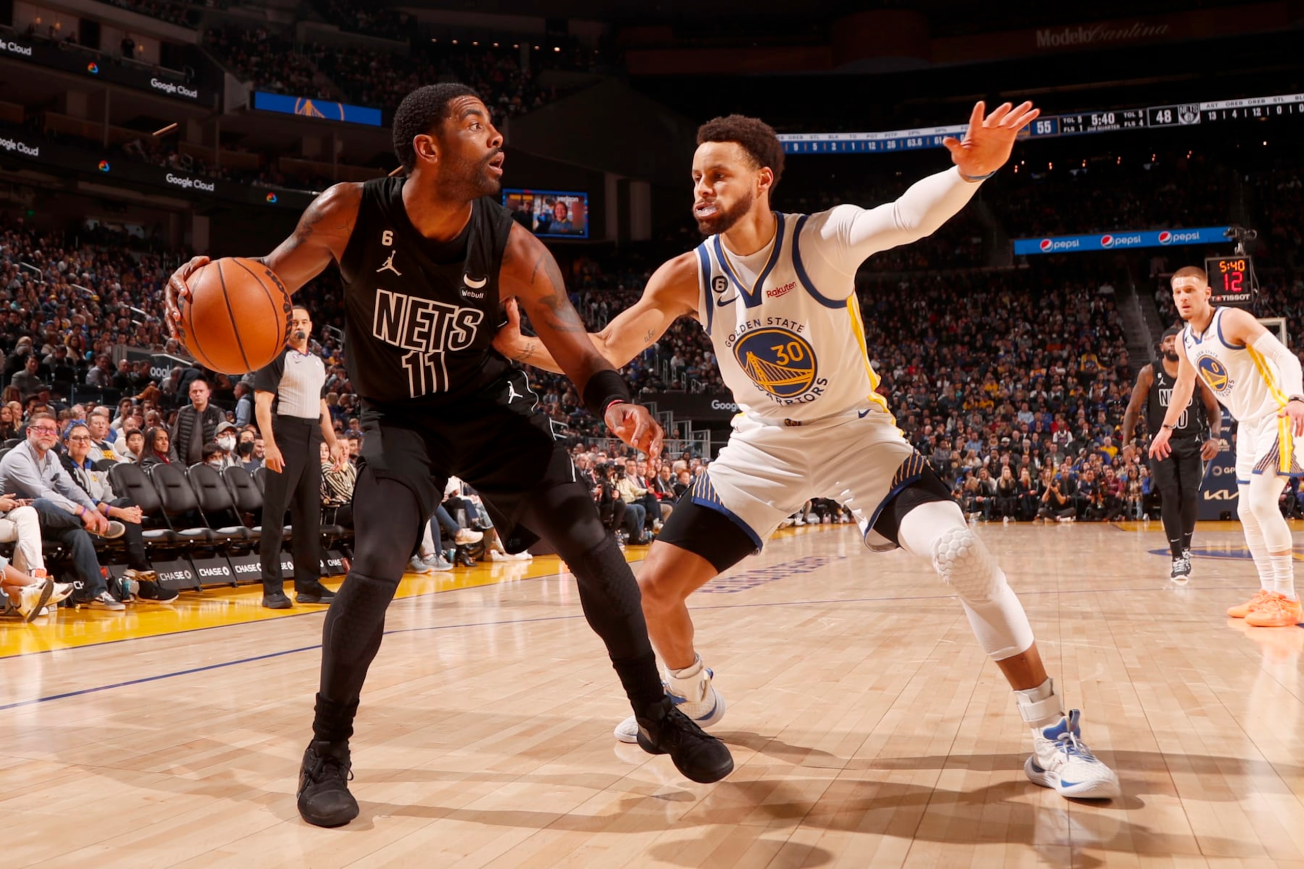 SAN FRANCISCO, CA - JANUARY 22: Kyrie Irving #11 of the Brooklyn Nets handles the ball against Stephen Curry #30 of the Golden State Warriors on January 22, 2023 at Chase Center in San Francisco, California. NOTE TO USER: User expressly acknowledges and agrees that, by downloading and or using this photograph, user is consenting to the terms and conditions of Getty Images License Agreement. Mandatory Copyright Notice: Copyright 2023 NBAE (Photo by Jed Jacobsohn/NBAE via Getty Images)