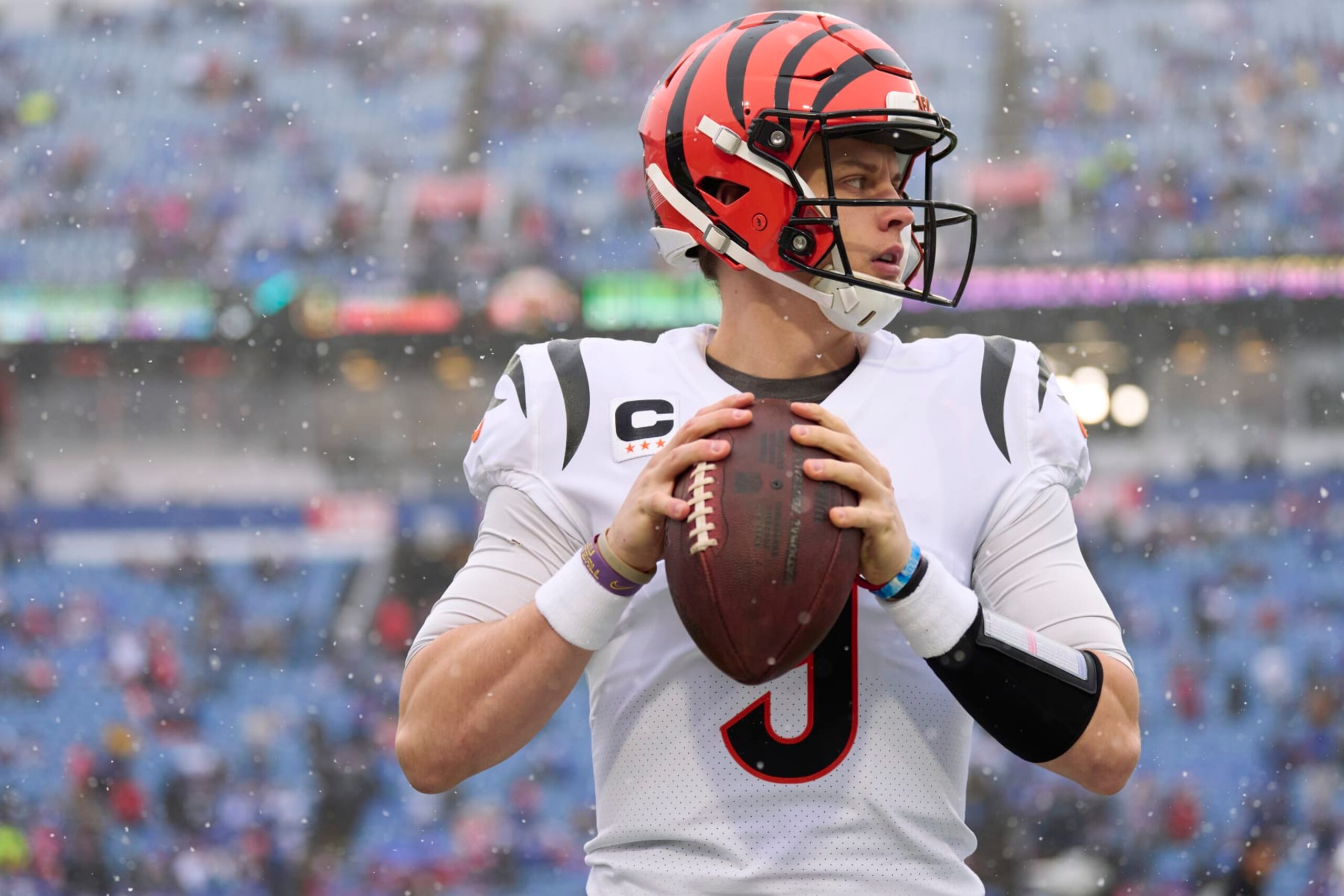 ORCHARD PARK, NY - JANUARY 22: Joe Burrow #9 of the Cincinnati Bengals warms up before kickoff against the Buffalo Bills at Highmark Stadium on January 22, 2023 in Orchard Park, New York. (Photo by Cooper Neill/Getty Images)
