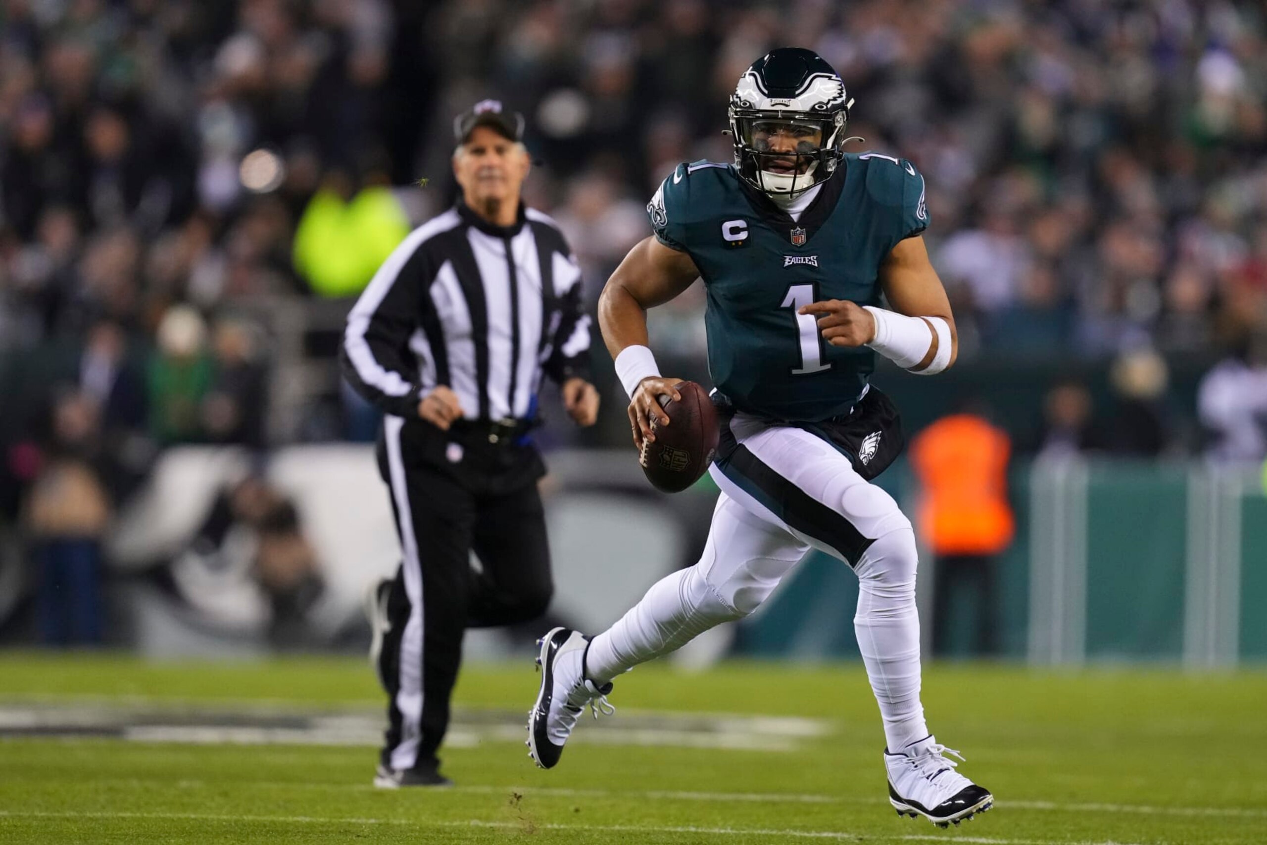 PHILADELPHIA, PA - JANUARY 21: Jalen Hurts #1 of the Philadelphia Eagles runs with the ball against the New York Giants during the NFC Divisional Playoff game at Lincoln Financial Field on January 21, 2023 in Philadelphia, Pennsylvania. (Photo by Mitchell Leff/Getty Images)