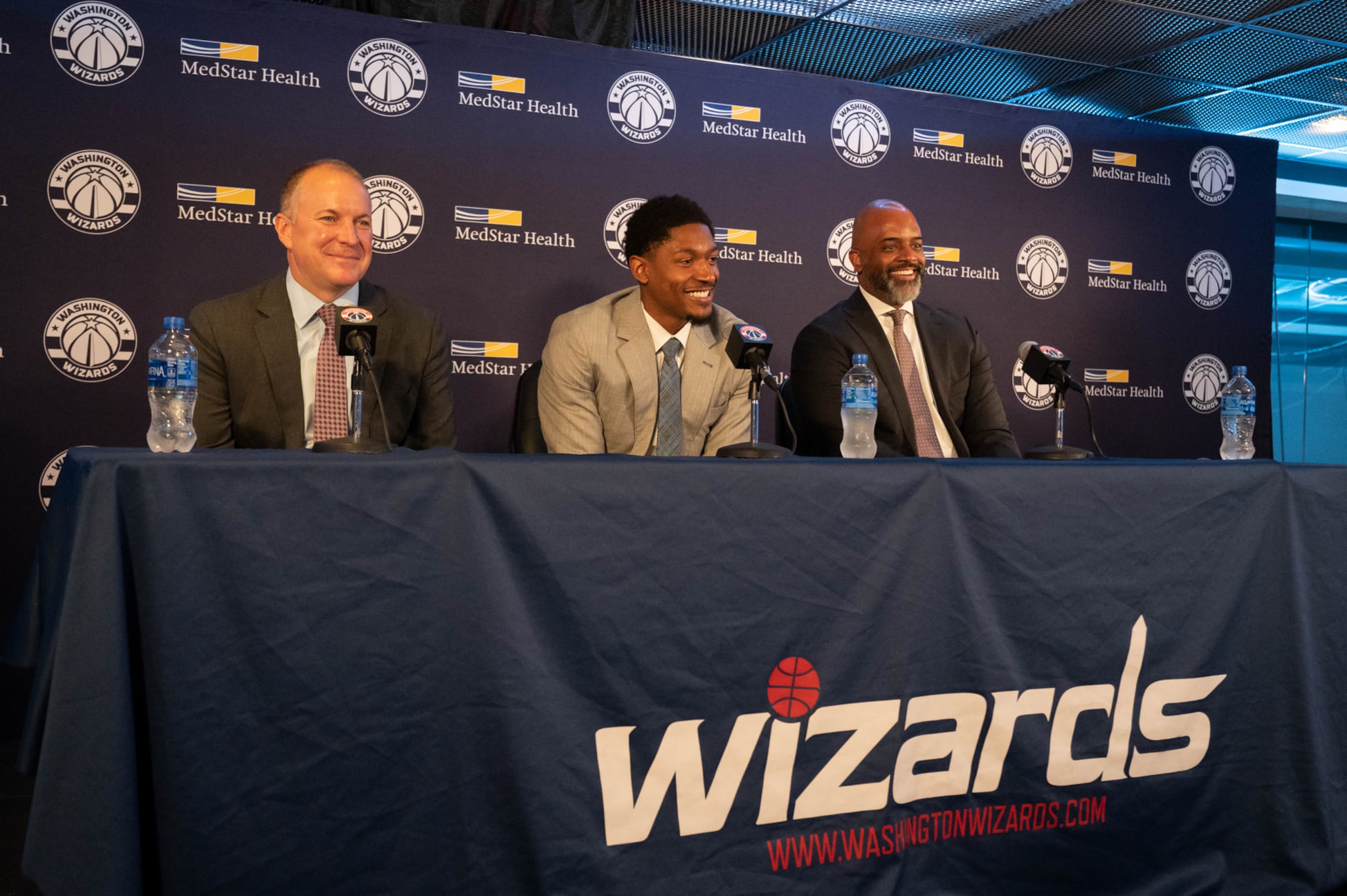 WASHINGTON, DC - JULY 08: From left, Wizards President and General Manager Tommy Sheppard, Wizards Guard Bradley Beal and Wizards Head Coach Wes Unseld Jr. are seen during a press conference at Capitol One Arena in Washington, DC, on July 08, 2022. (Photo by Craig Hudson for The Washington Post via Getty Images)