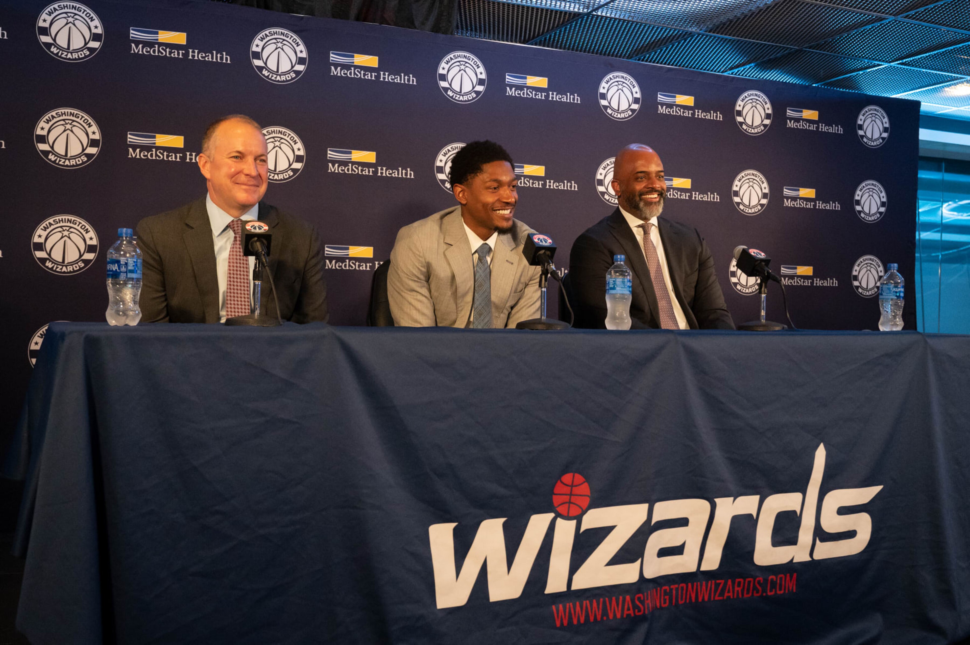 WASHINGTON, DC - JULY 08: From left, Wizards President and General Manager Tommy Sheppard, Wizards Guard Bradley Beal and Wizards Head Coach Wes Unseld Jr. are seen during a press conference at Capitol One Arena in Washington, DC, on July 08, 2022. (Photo by Craig Hudson for The Washington Post via Getty Images)
