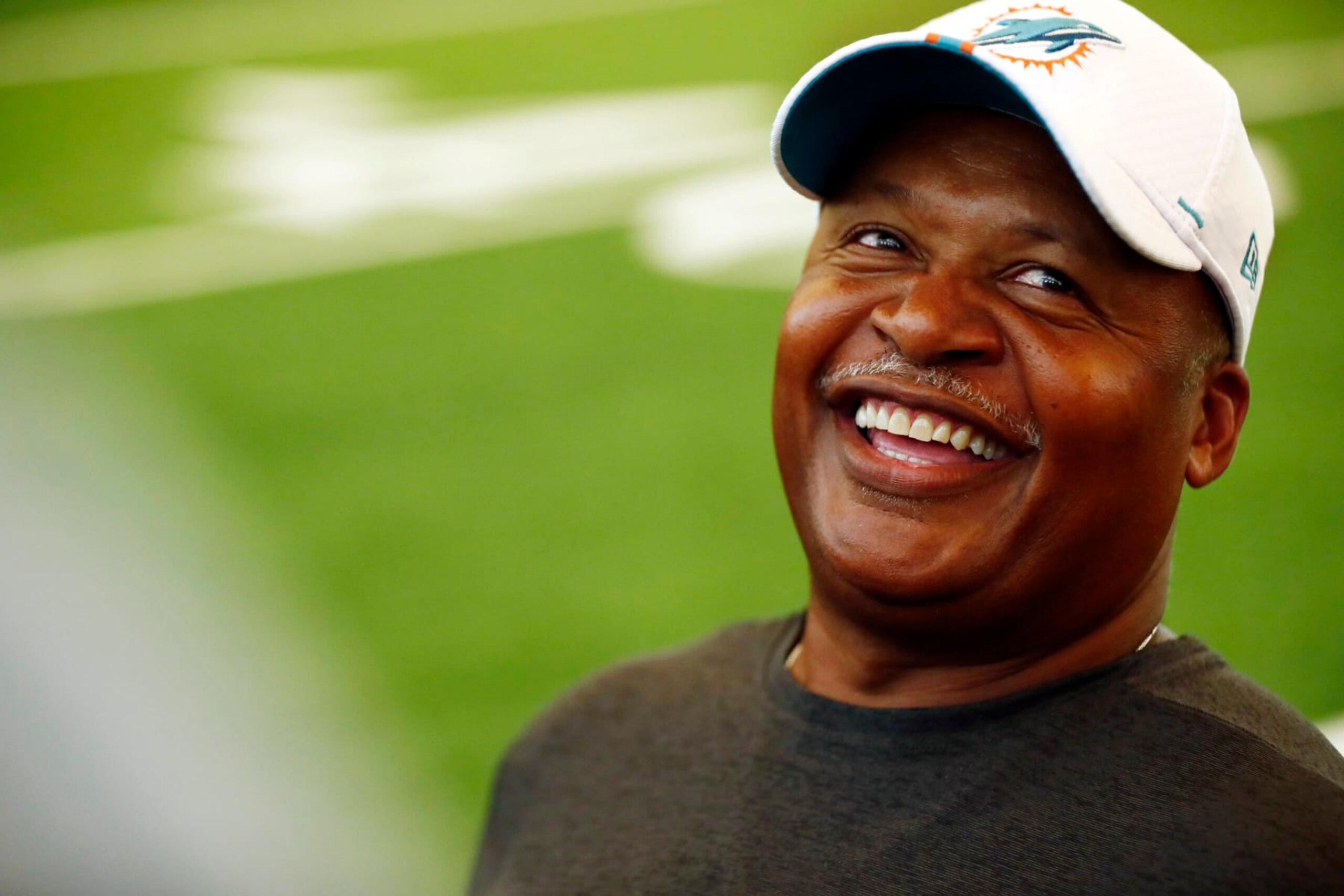 Miami Dolphins assistant head coach Jim Caldwell laughs during NFL rookie camp on Thursday, May 9, 2019, in Davie, Fla. (AP Photo/Brynn Anderson)