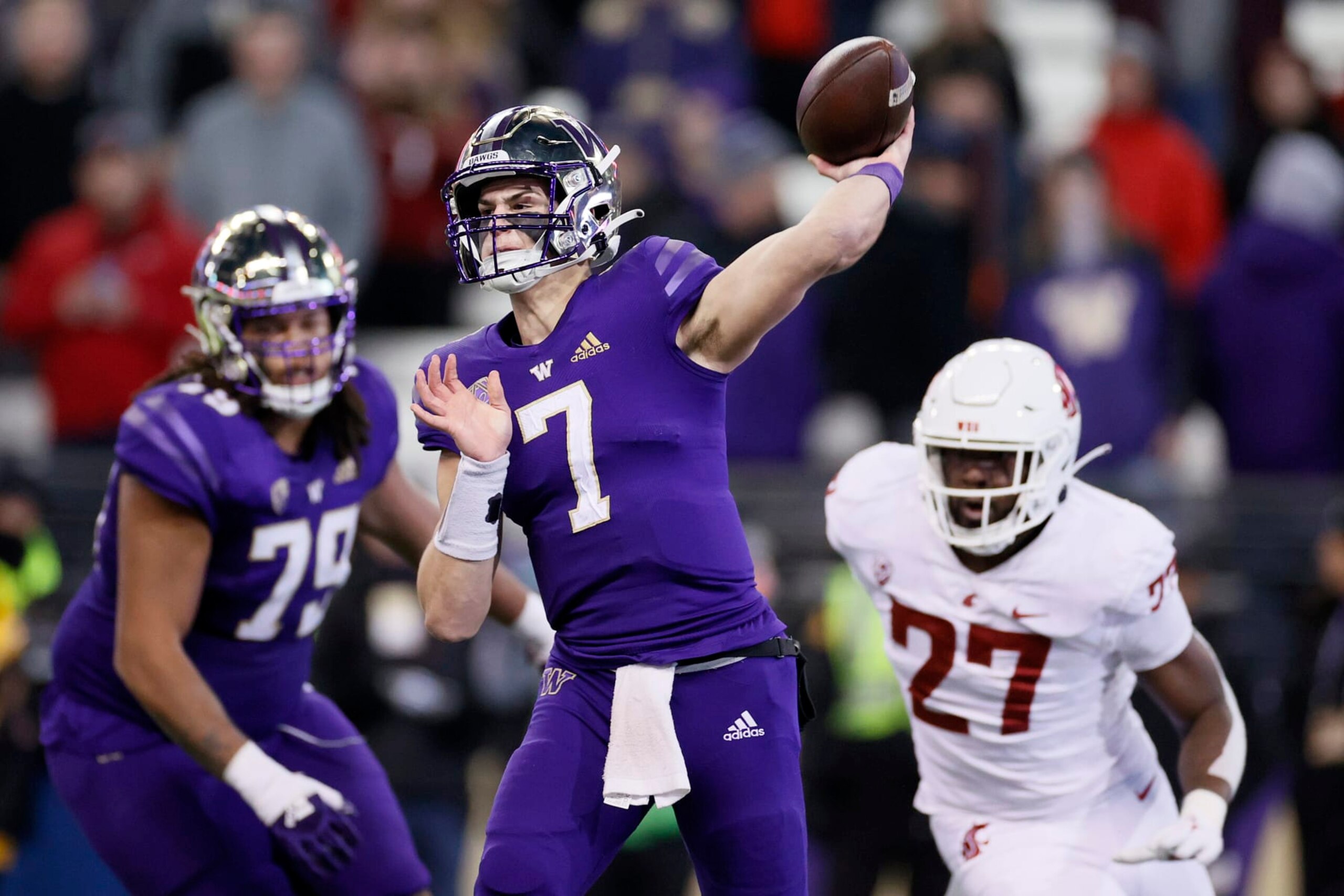 SEATTLE, WASHINGTON - NOVEMBER 26: Sam Huard #7 of the Washington Huskies throws a pass against the Washington State Cougars during the fourth quarter at Husky Stadium on November 26, 2021 in Seattle, Washington. (Photo by Steph Chambers/Getty Images)