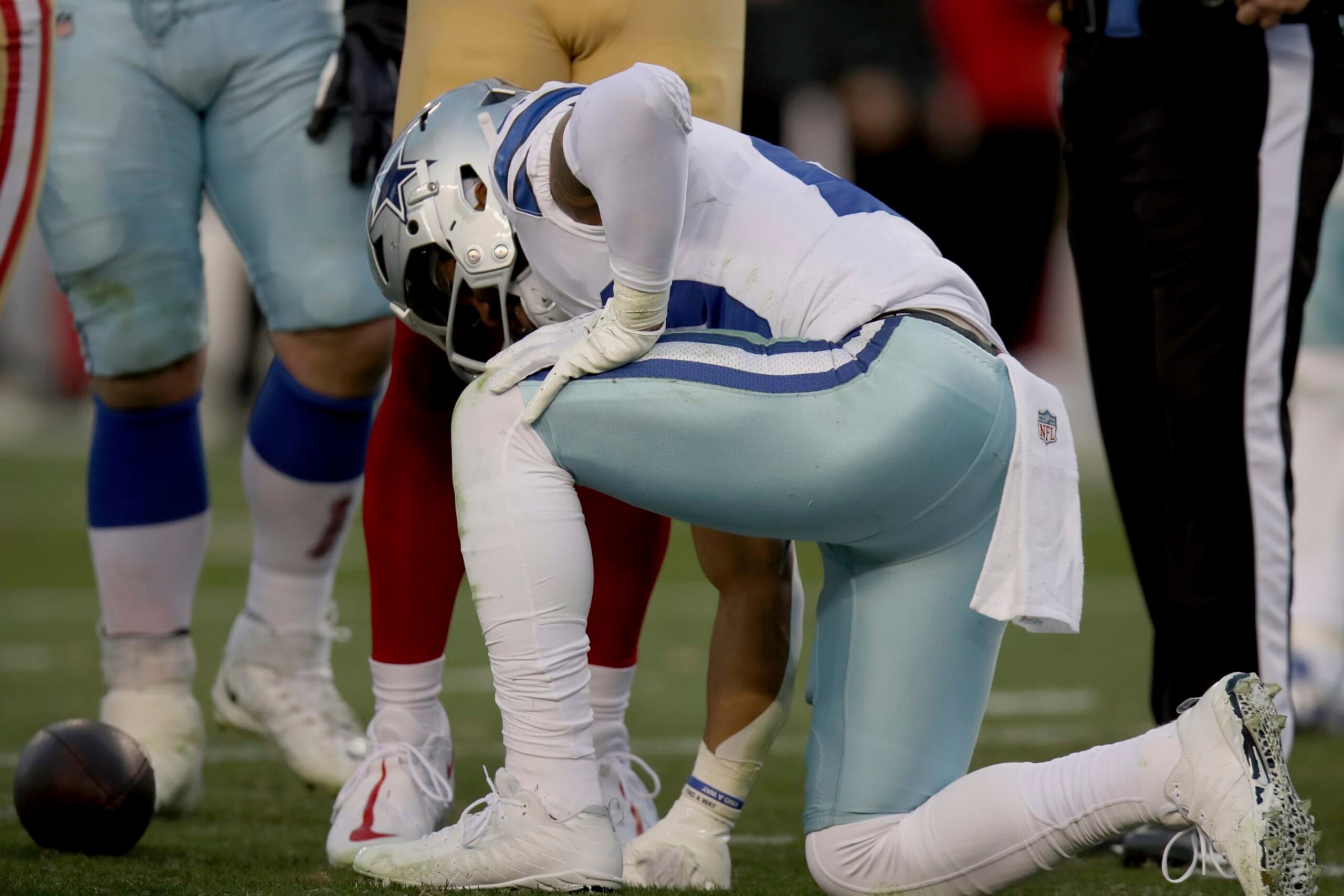 Dallas Cowboys running back Tony Pollard (20) kneels on the field during an NFL divisional round playoff football game against the San Francisco 49ers, Sunday, Jan. 22, 2023, in Santa Clara, Calif. (AP Photo/Scot Tucker)