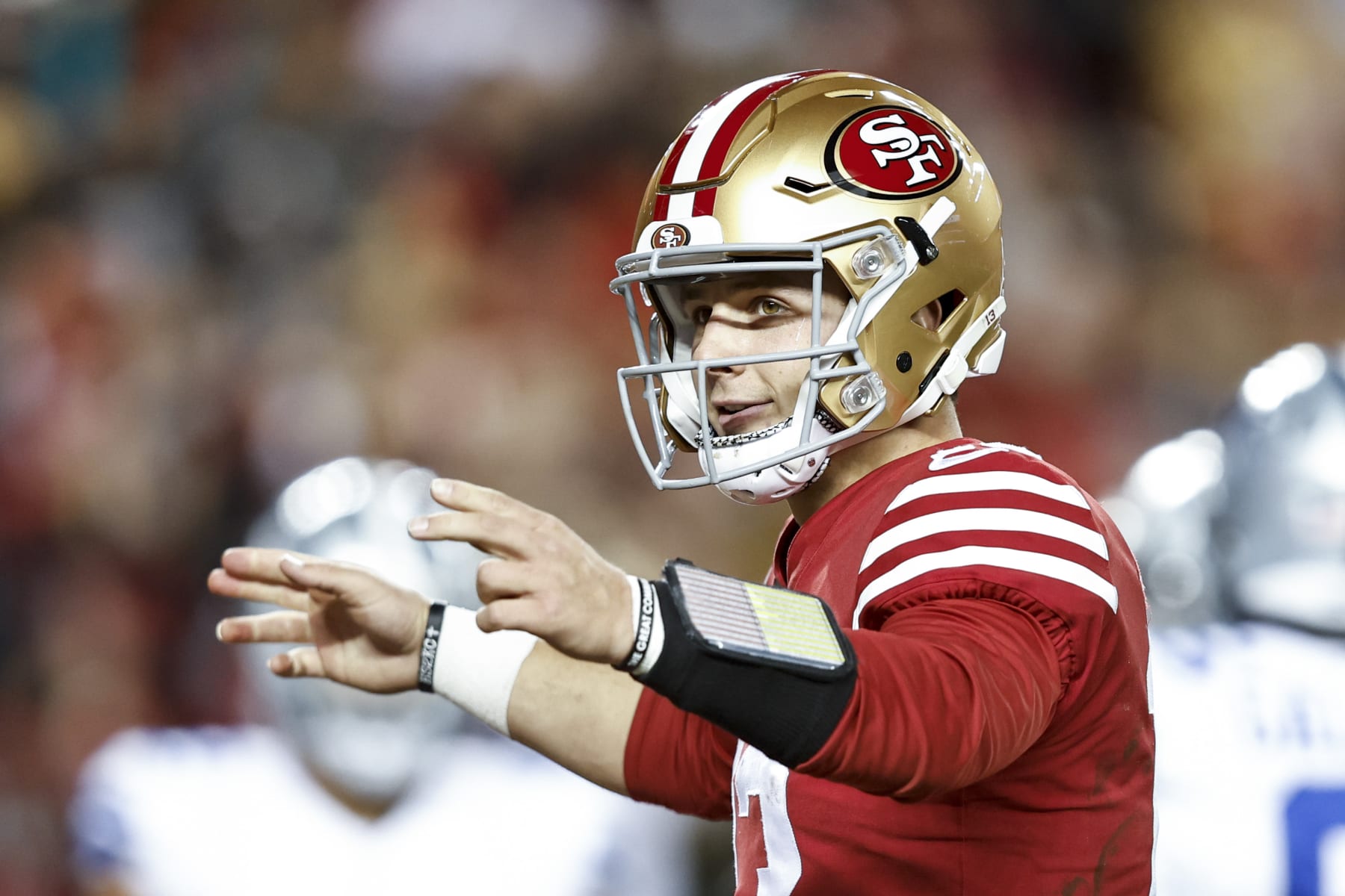 SANTA CLARA, CALIFORNIA - JANUARY 22: Brock Purdy #13 of the San Francisco 49ers celebrates after handing off the ball for a touchdown during an NFL divisional round playoff football game between the San Francisco 49ers and the Dallas Cowboys at Levi's Stadium on January 22, 2023 in Santa Clara, California. (Photo by Michael Owens/Getty Images)