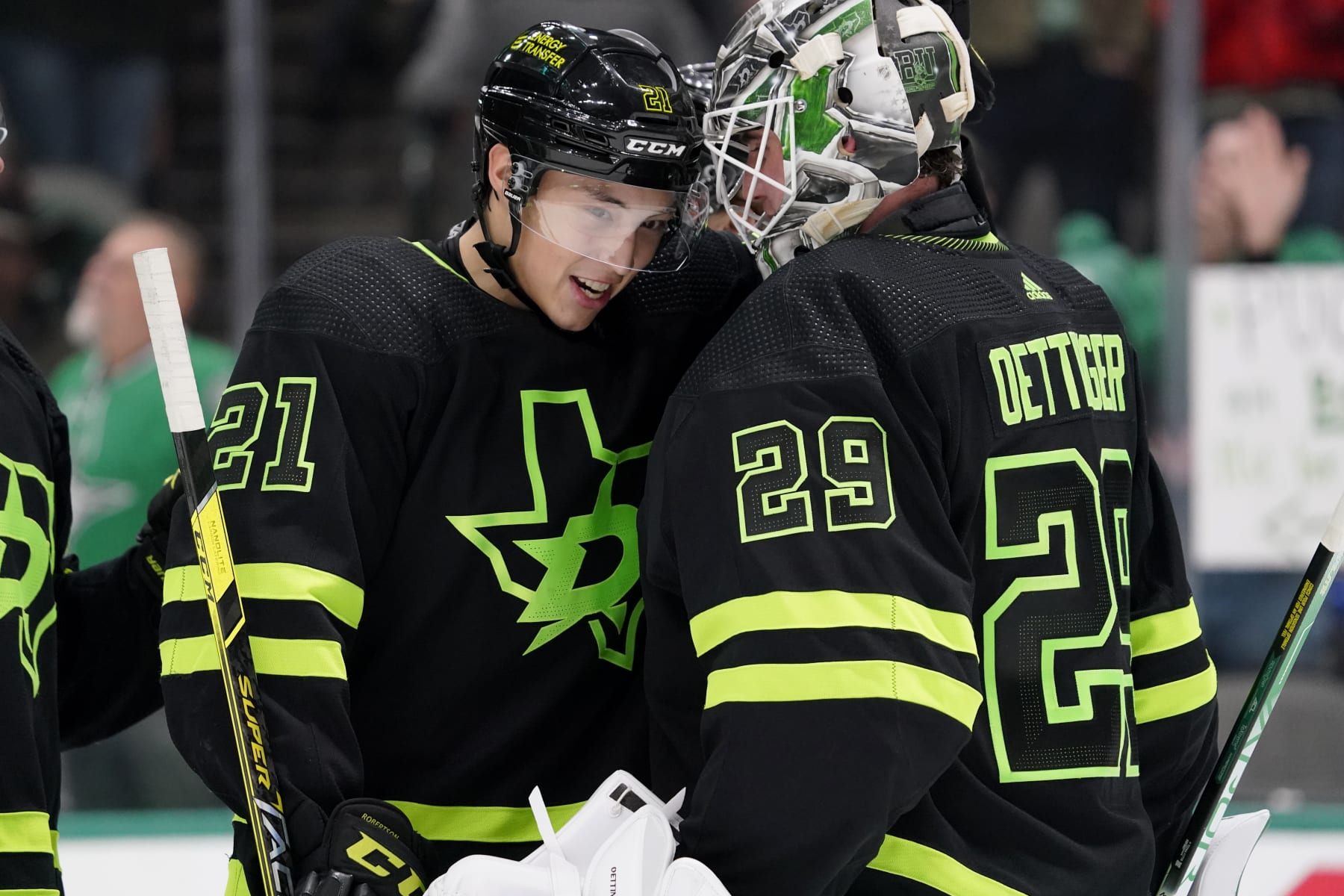 DALLAS, TEXAS - JANUARY 21: Jake Oettinger #29 of the Dallas Stars is congratulated by Jason Robertson #21 following the game against the Arizona Coyotes at American Airlines Center on January 21, 2023 in Dallas, Texas. Dallas won 4-0. (Photo by Sam Hodde/NHLI via Getty Images)