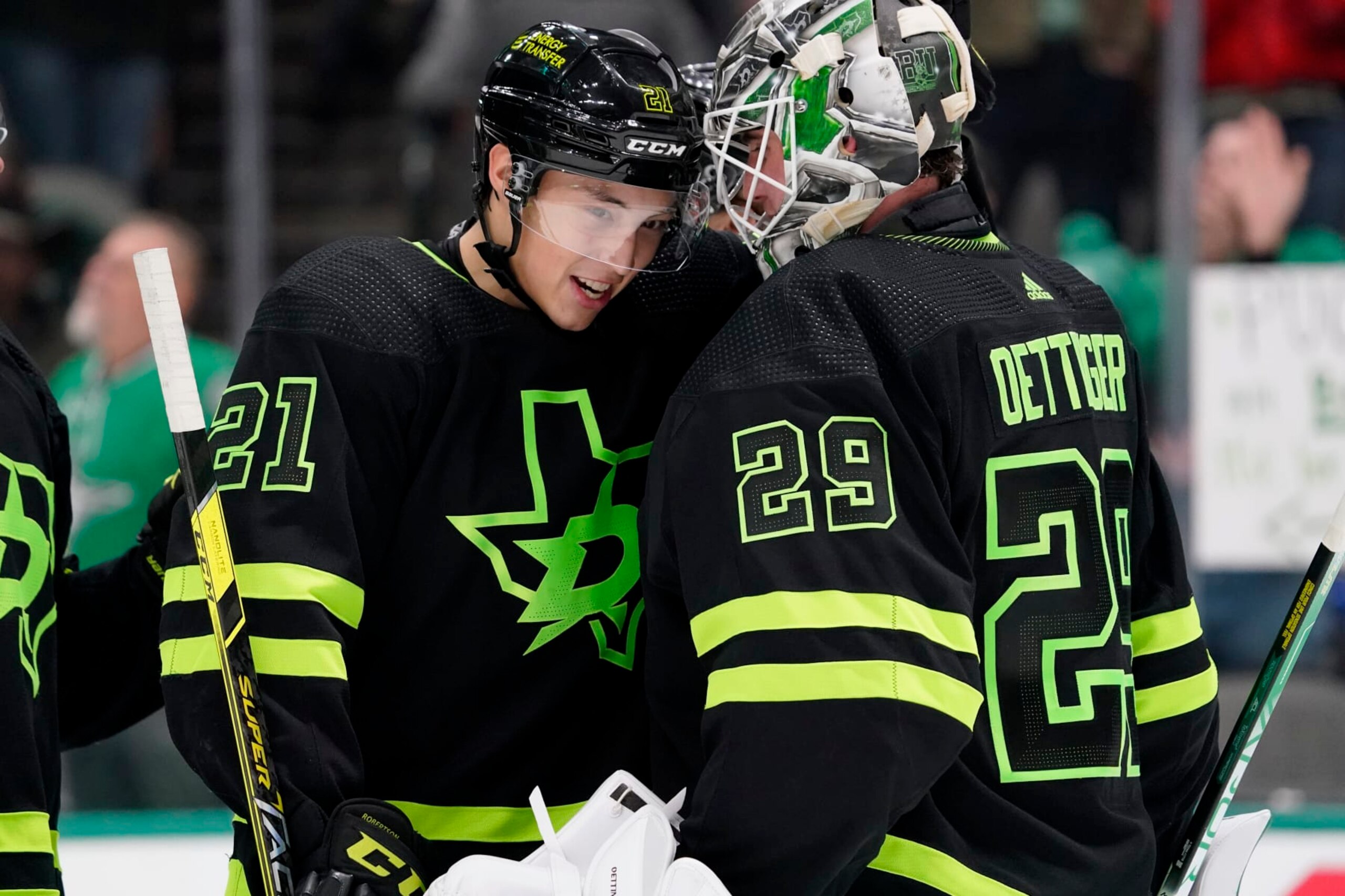 DALLAS, TEXAS - JANUARY 21: Jake Oettinger #29 of the Dallas Stars is congratulated by Jason Robertson #21 following the game against the Arizona Coyotes at American Airlines Center on January 21, 2023 in Dallas, Texas. Dallas won 4-0. (Photo by Sam Hodde/NHLI via Getty Images)