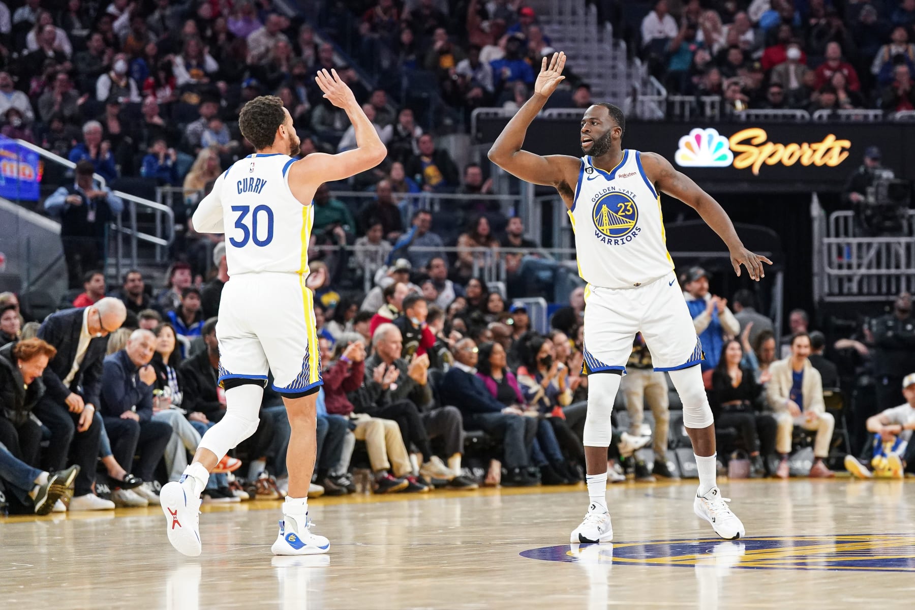 SAN FRANCISCO, CA - JANUARY 22: Stephen Curry #30 and Draymond Green #23 of the Golden State Warriors celebrate a basket in the second quarter against the Brooklyn Nets at Chase Center on January 22, 2023 in San Francisco, California. NOTE TO USER: User expressly acknowledges and agrees that, by downloading and/or using this photograph, User is consenting to the terms and conditions of the Getty Images License Agreement. (Photo by Kavin Mistry/Getty Images)