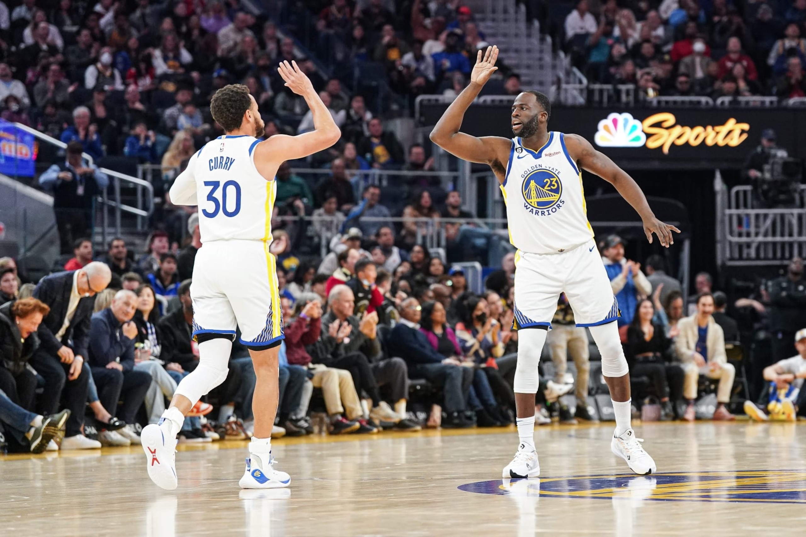 SAN FRANCISCO, CA - JANUARY 22: Stephen Curry #30 and Draymond Green #23 of the Golden State Warriors celebrate a basket in the second quarter against the Brooklyn Nets at Chase Center on January 22, 2023 in San Francisco, California. NOTE TO USER: User expressly acknowledges and agrees that, by downloading and/or using this photograph, User is consenting to the terms and conditions of the Getty Images License Agreement. (Photo by Kavin Mistry/Getty Images)