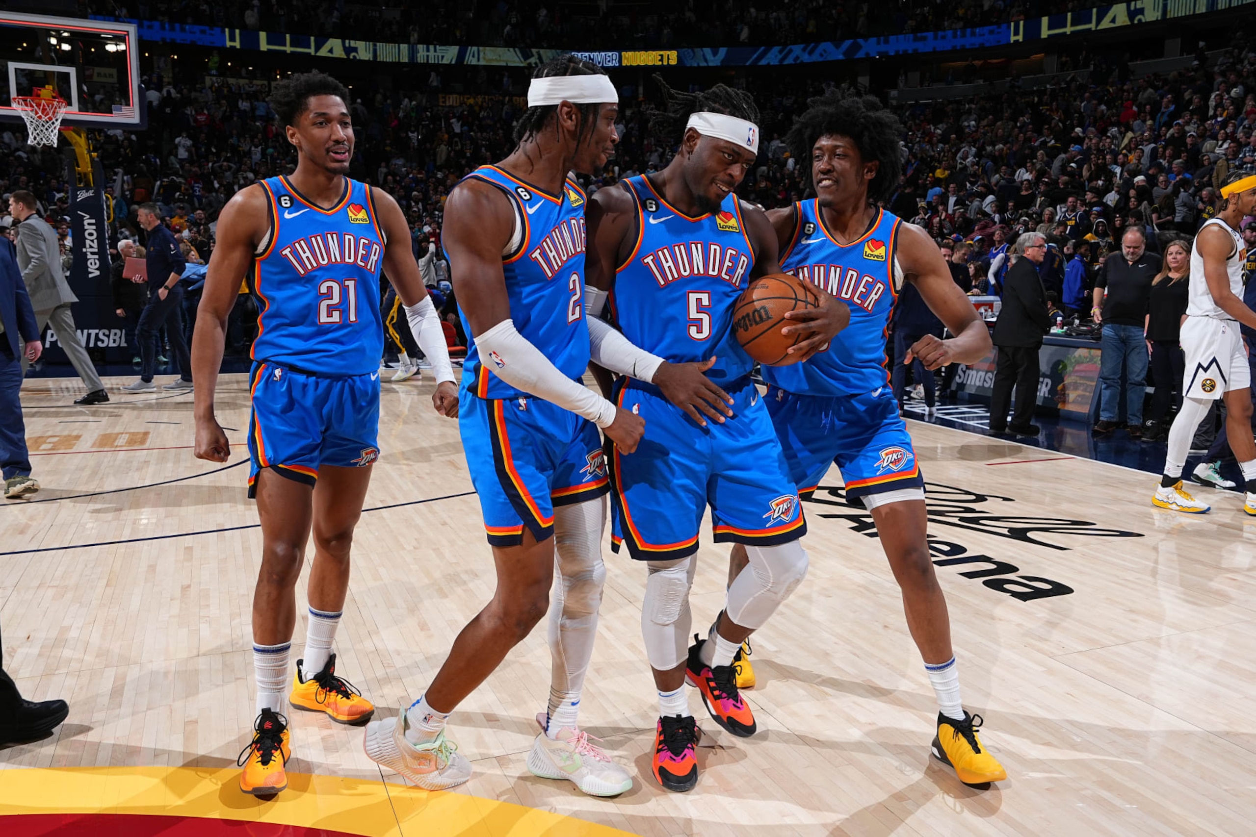 DENVER, CO - JANUARY 22: The Oklahoma City Thunder celebrate and walk off the court after beating the Denver Nuggets on January 22, 2023 at the Ball Arena in Denver, Colorado. NOTE TO USER: User expressly acknowledges and agrees that, by downloading and/or using this Photograph, user is consenting to the terms and conditions of the Getty Images License Agreement. Mandatory Copyright Notice: Copyright 2023 NBAE (Photo by Garrett Ellwood/NBAE via Getty Images)