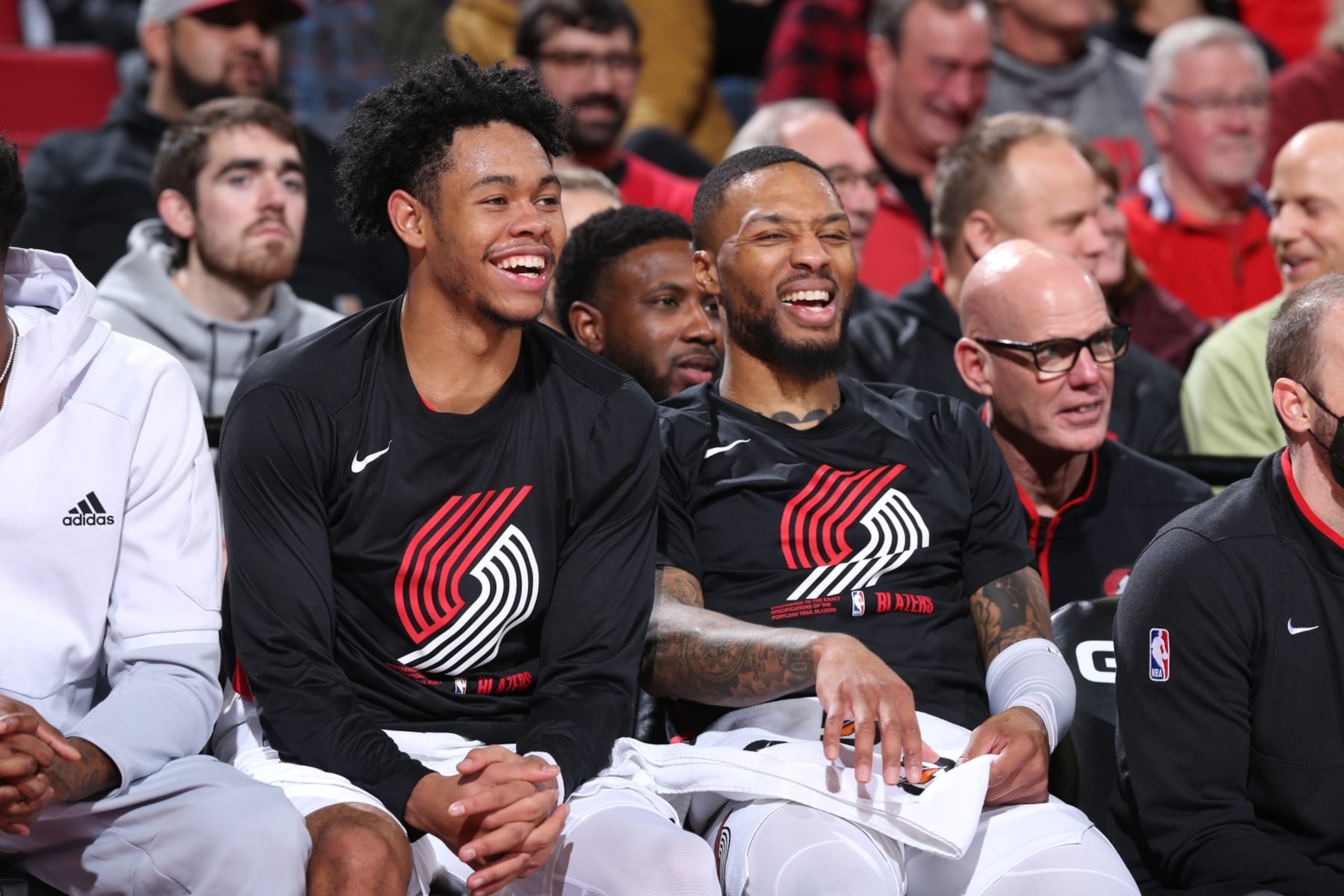 PORTLAND, OR - JANUARY 2: Anfernee Simons #1 and Damian Lillard #0 of the Portland Trail Blazers look on during the game against the Detroit Pistons on January 2, 2023 at the Moda Center Arena in Portland, Oregon. NOTE TO USER: User expressly acknowledges and agrees that, by downloading and or using this photograph, user is consenting to the terms and conditions of the Getty Images License Agreement. Mandatory Copyright Notice: Copyright 2023 NBAE (Photo by Sam Forencich/NBAE via Getty Images)