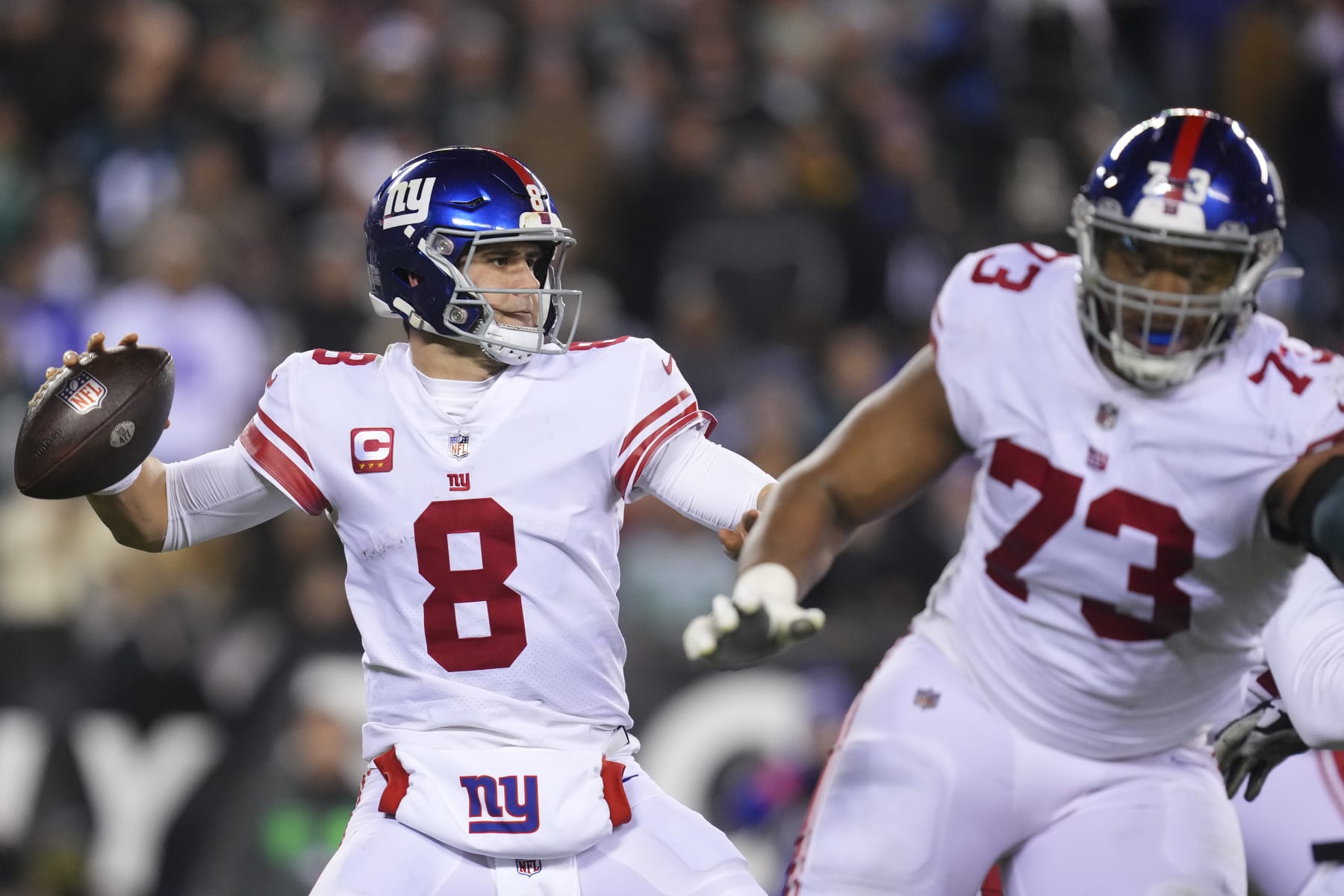 PHILADELPHIA, PA - JANUARY 21: Daniel Jones #8 of the New York Giants passes the ball as Evan Neal #73 blocks against the Philadelphia Eagles during the NFC Divisional Playoff game at Lincoln Financial Field on January 21, 2023 in Philadelphia, Pennsylvania. (Photo by Mitchell Leff/Getty Images)