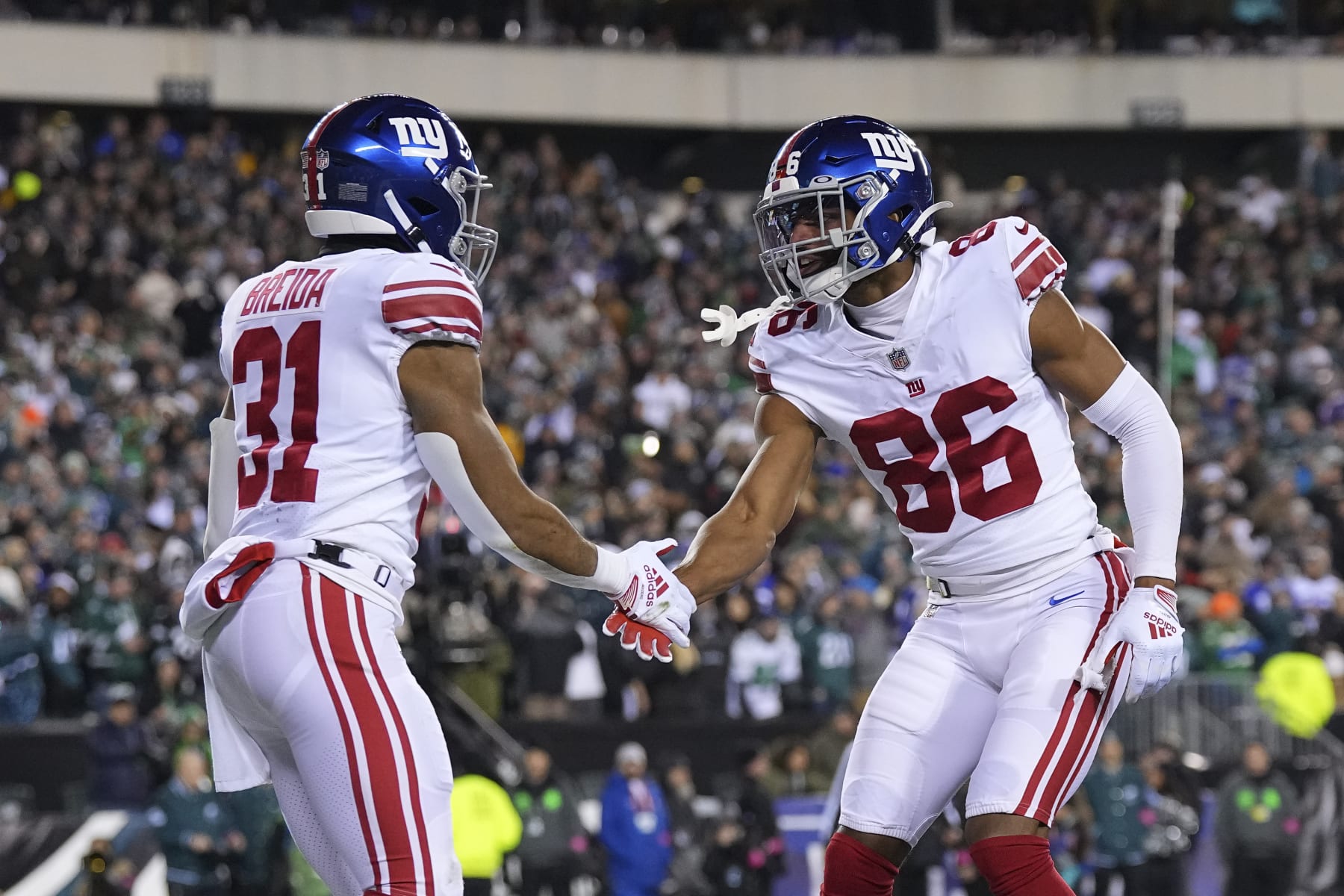 PHILADELPHIA, PA - JANUARY 21: Matt Breida #31 of the New York Giants celebrates with Darius Slayton #86 against the Philadelphia Eagles during the NFC Divisional Playoff game at Lincoln Financial Field on January 21, 2023 in Philadelphia, Pennsylvania. (Photo by Mitchell Leff/Getty Images)