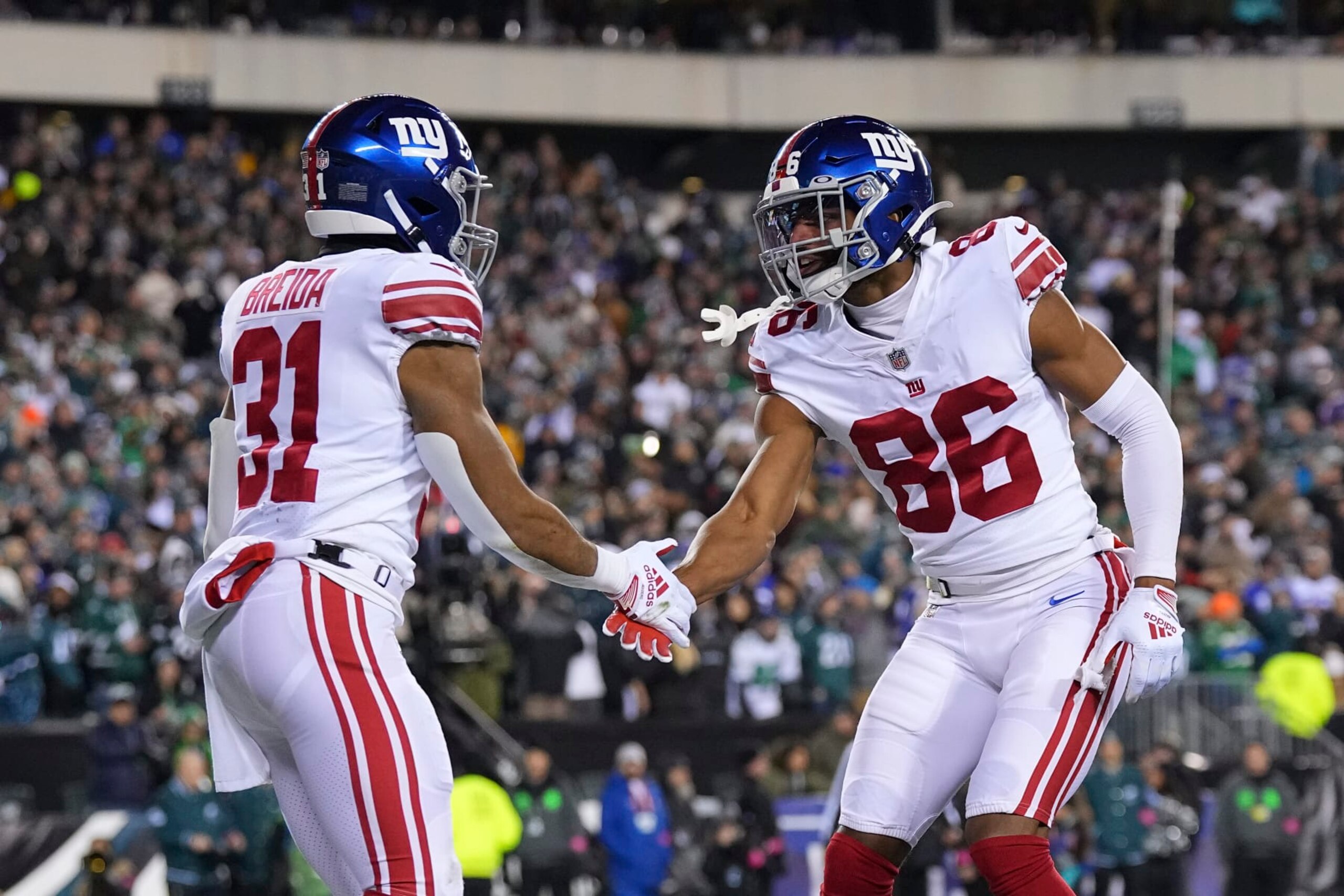 PHILADELPHIA, PA - JANUARY 21: Matt Breida #31 of the New York Giants celebrates with Darius Slayton #86 against the Philadelphia Eagles during the NFC Divisional Playoff game at Lincoln Financial Field on January 21, 2023 in Philadelphia, Pennsylvania. (Photo by Mitchell Leff/Getty Images)