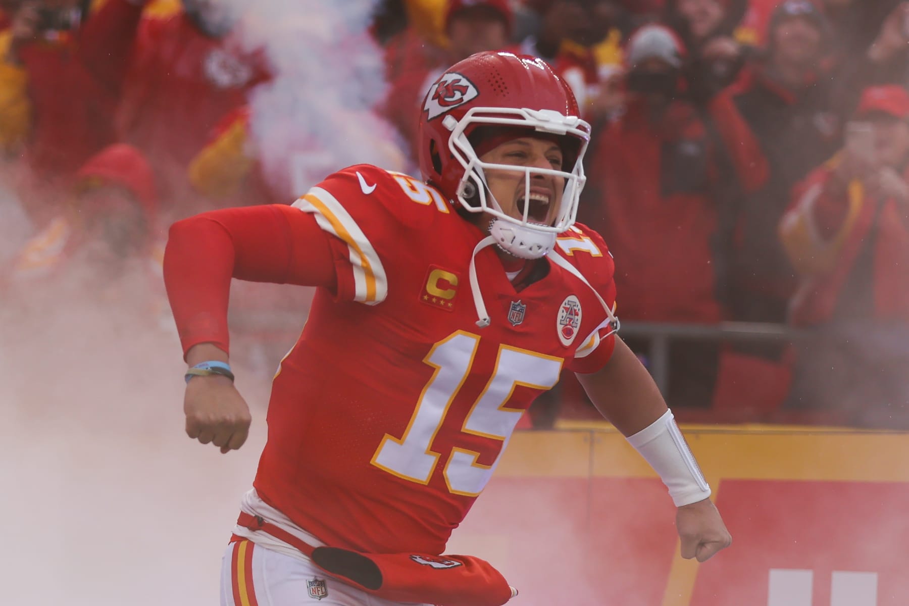 KANSAS CITY, MO - JANUARY 21: Kansas City Chiefs quarterback Patrick Mahomes (15) flexes as smokes rises around him before an AFC divisional playoff game between the Jacksonville Jaguars and Kansas City Chiefs on January 21, 2023 at GEHA Field at Arrowhead Stadium in Kansas City, MO. (Photo by Scott Winters/Icon Sportswire via Getty Images)