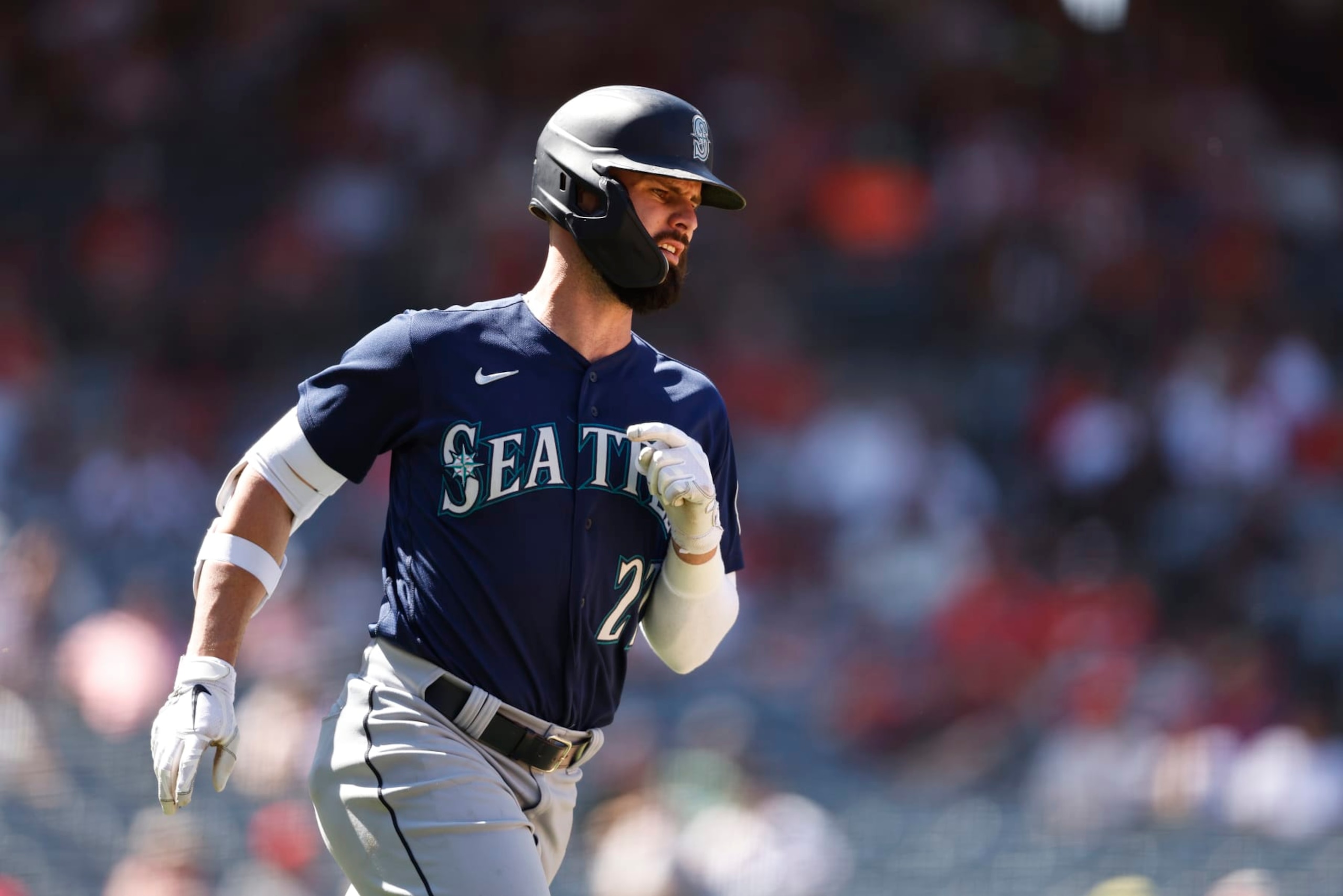 ANAHEIM, CALIFORNIA - AUGUST 17: Jesse Winker #27 of the Seattle Mariners runs to first base during the sixth inning of a game between the Los Angeles Angels and the Seattle Mariners at Angel Stadium of Anaheim on August 17, 2022 in Anaheim, California. (Photo by Michael Owens/Getty Images) ANAHEIM, CALIFORNIA - AUGUST 17: Jesse Winker #27 of the Seattle Mariners runs to first base during the sixth inning of a game between the Los Angeles Angels and the Seattle Mariners at Angel Stadium of Anaheim on August 17, 2022 in Anaheim, California. (Photo by Michael Owens/Getty Images)