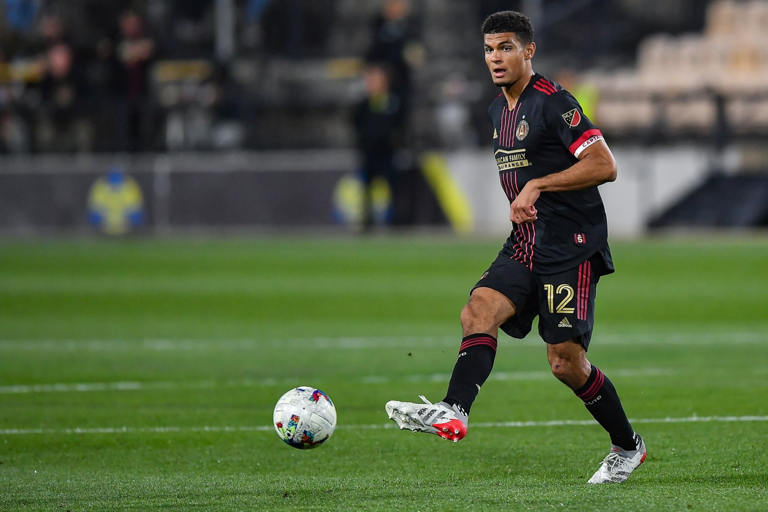 KENNESAW, GA  APRIL 20:  Atlanta defender Miles Robinson (12) passes the ball during the Lamar Hunt US Open Cup match between Chattanooga FC and Atlanta United FC on April 20th, 2022 at Fifth Third Bank Stadium in Kennesaw, GA.  (Photo by Rich von Biberstein/Icon Sportswire via Getty Images)