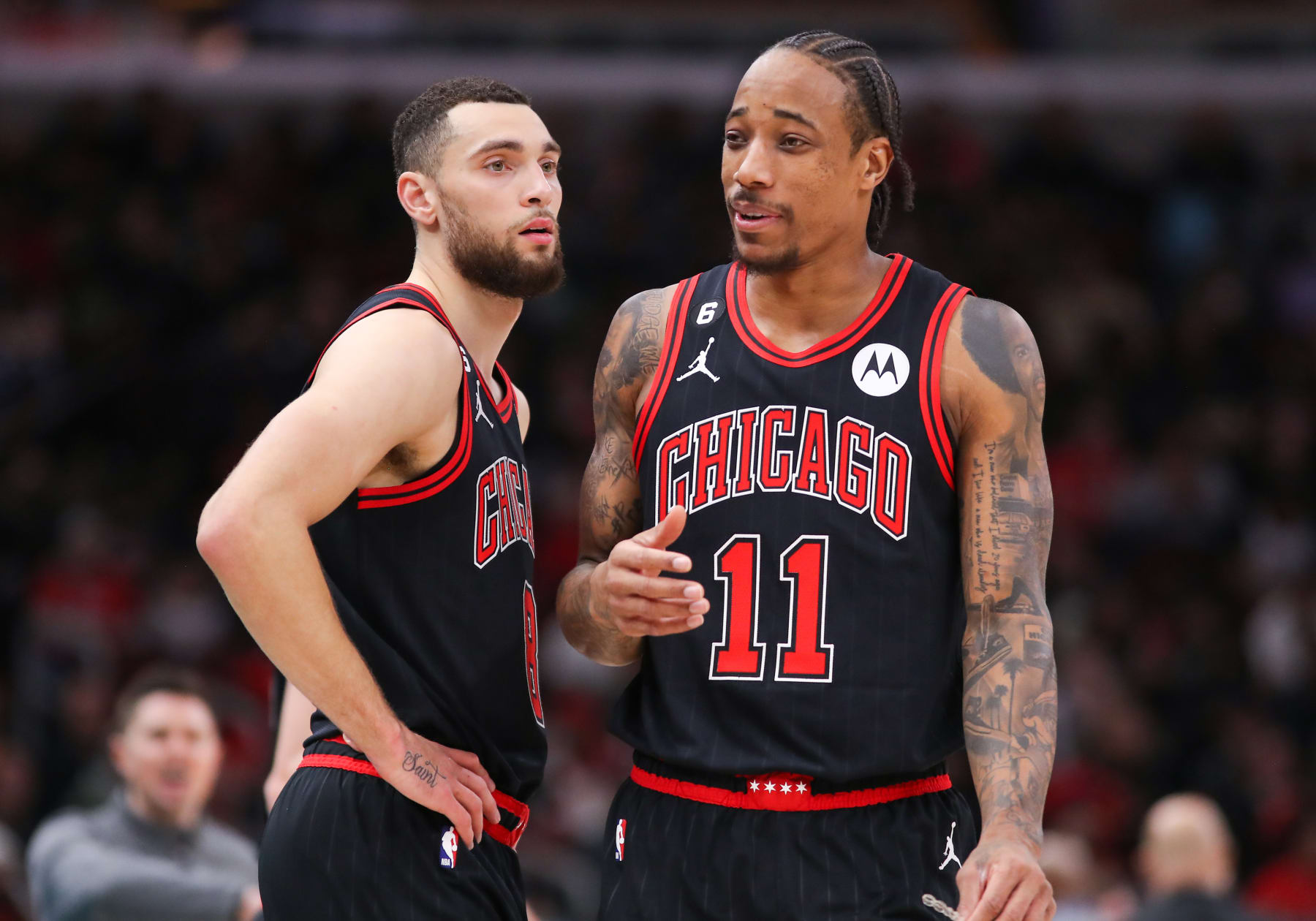 CHICAGO, IL - JANUARY 23: Chicago Bulls Guard Zach LaVine (8) and Chicago Bulls Forward DeMar DeRozan (11) chat during a NBA game between the Atlanta  Hawks and the Chicago Bulls on January 23, 2023 at the United Center in Chicago, IL. (Photo by Melissa Tamez/Icon Sportswire via Getty Images)