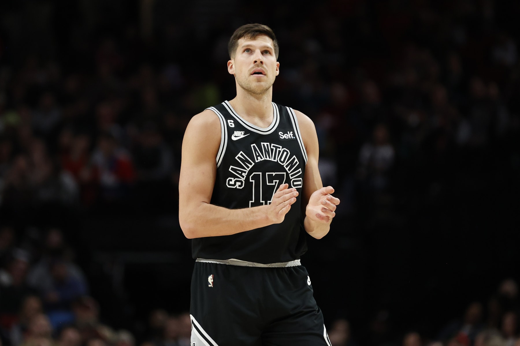 PORTLAND, OREGON - JANUARY 23: Doug McDermott #17 of the San Antonio Spurs reacts during the third quarter against the Portland Trail Blazers at Moda Center on January 23, 2023 in Portland, Oregon. NOTE TO USER: User expressly acknowledges and agrees that, by downloading and/or using this photograph, User is consenting to the terms and conditions of the Getty Images License Agreement. (Photo by Steph Chambers/Getty Images)