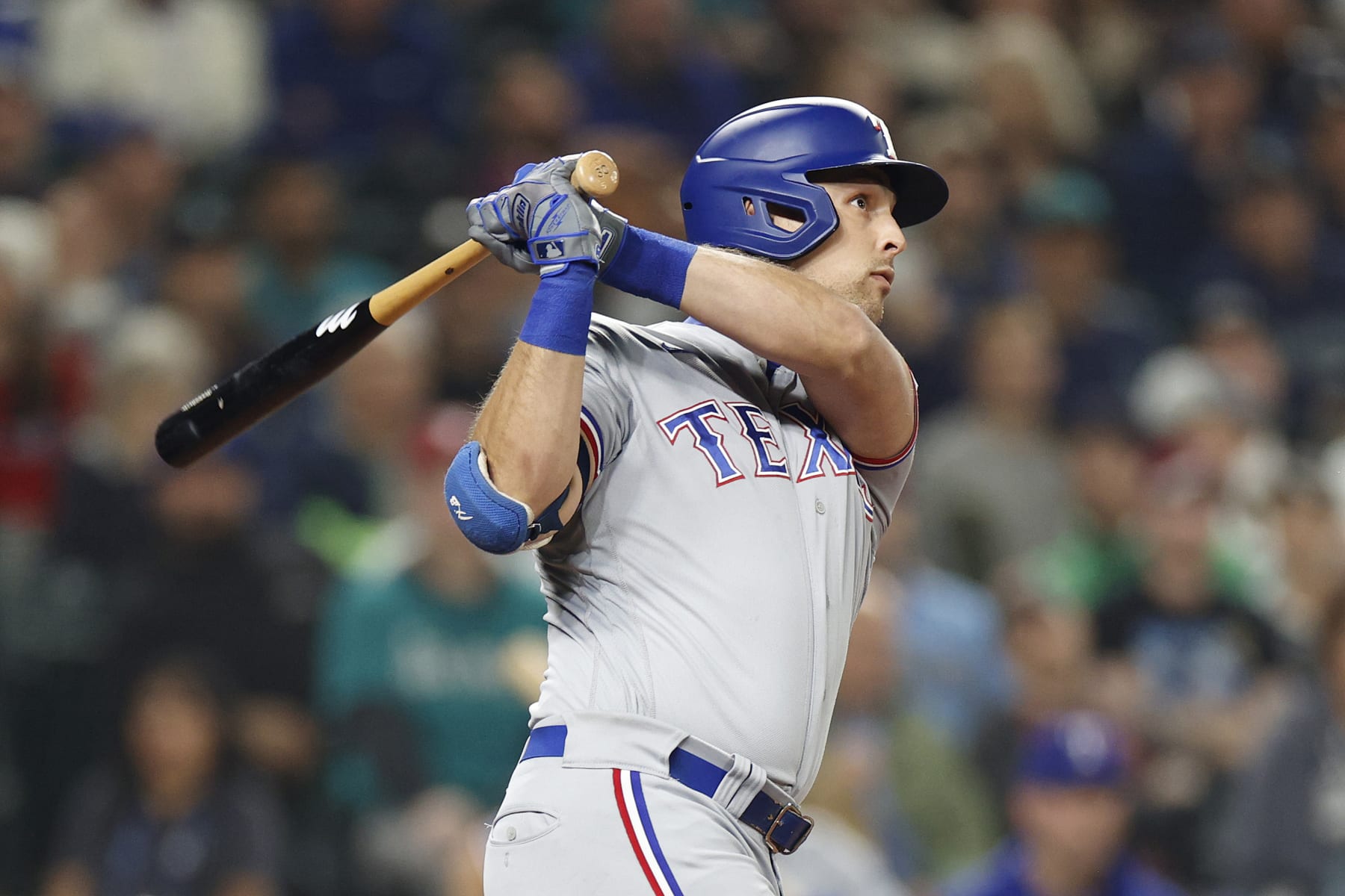 SEATTLE, WASHINGTON - SEPTEMBER 29: Nathaniel Lowe #30 of the Texas Rangers hits a home run against the Seattle Mariners during the seventh inning at T-Mobile Park on September 29, 2022 in Seattle, Washington. (Photo by Steph Chambers/Getty Images)