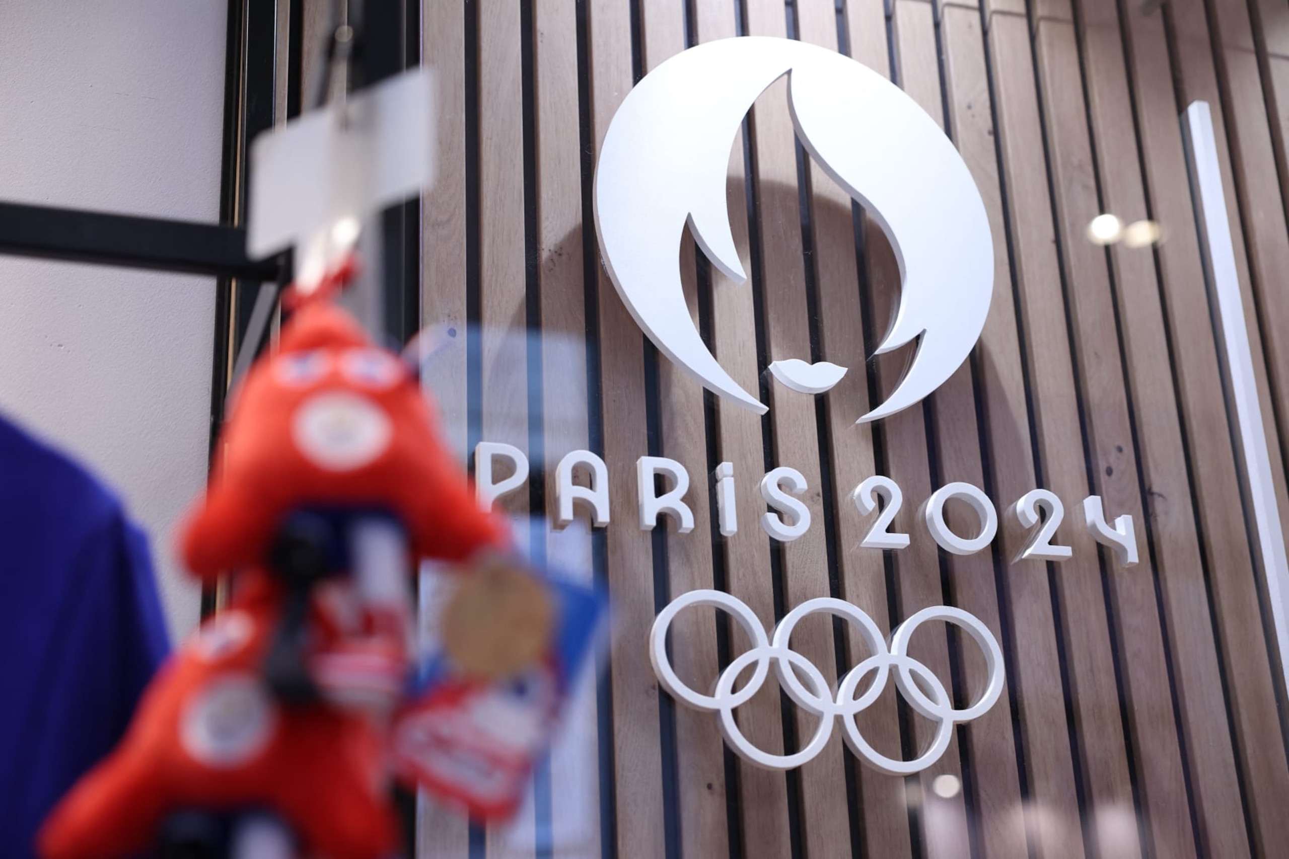 This photograph taken on November 15, 2022, in Paris, shows the Paris 2024 Olympic and Paralympic Games official logo, displayed in the official Paris 2024 shop in Les Halles shopping mall in central Paris. - The Olympic and Paralympic mascots are named "Les Phryges" and represent French revolutionary Phrygian caps. (Photo by Thomas SAMSON / AFP) (Photo by THOMAS SAMSON/AFP via Getty Images) This photograph taken on November 15, 2022, in Paris, shows the Paris 2024 Olympic and Paralympic Games official logo, displayed in the official Paris 2024 shop in Les Halles shopping mall in central Paris. - The Olympic and Paralympic mascots are named "Les Phryges" and represent French revolutionary Phrygian caps. (Photo by Thomas SAMSON / AFP) (Photo by THOMAS SAMSON/AFP via Getty Images)