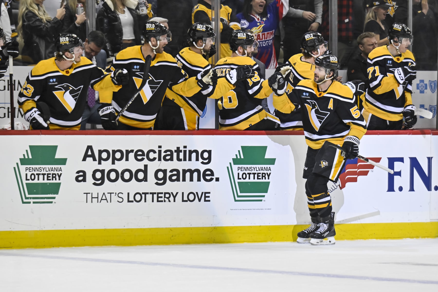 PITTSBURGH, PA - JANUARY 24: Pittsburgh Penguins Defenseman Kris Letang (58) celebrates his goal with the bench during the first period in the NHL game between the Pittsburgh Penguins and the Florida Panthers on January 24, 2023, at PPG Paints Arena in Pittsburgh, PA. (Photo by Jeanine Leech/Icon Sportswire via Getty Images)