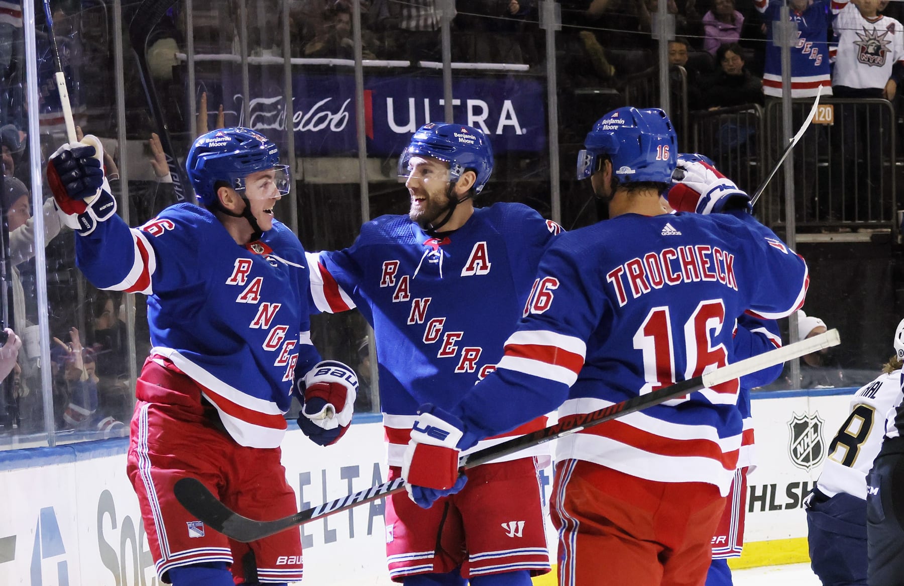 NEW YORK, NEW YORK - JANUARY 23: Jimmy Vesey #26 of the New York Rangers (L) celebrates his second period goal against the and is joined by Barclay Goodrow #21 (C) and Vincent Trocheck #16 (R) at Madison Square Garden on January 23, 2023 in New York City. (Photo by Bruce Bennett/Getty Images)