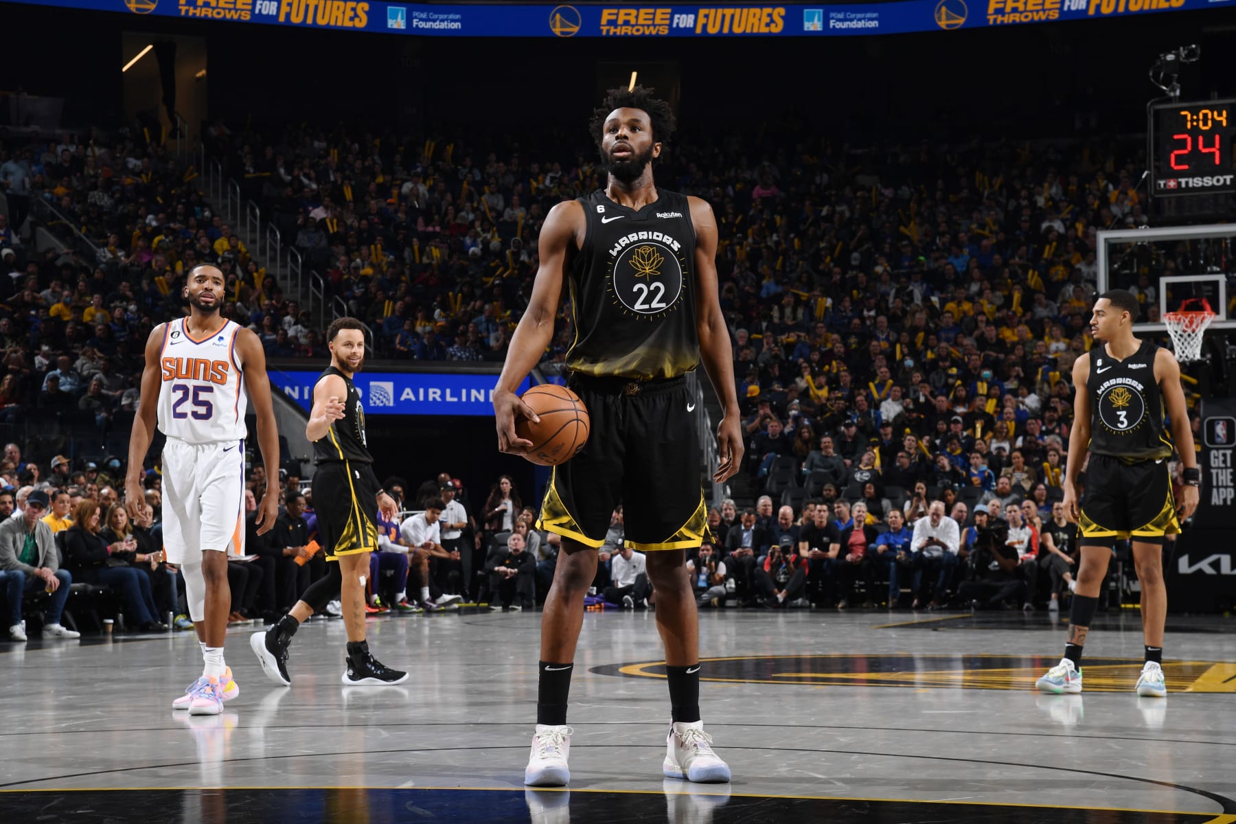 SAN FRANCISCO, CA - JANUARY 10: Andrew Wiggins #22 of the Golden State Warriors shoots the ball during the game against the Phoenix Suns on January 10, 2023 at Chase Center in San Francisco, California. NOTE TO USER: User expressly acknowledges and agrees that, by downloading and or using this photograph, user is consenting to the terms and conditions of Getty Images License Agreement. Mandatory Copyright Notice: Copyright 2022 NBAE (Photo by Noah Graham/NBAE via Getty Images)