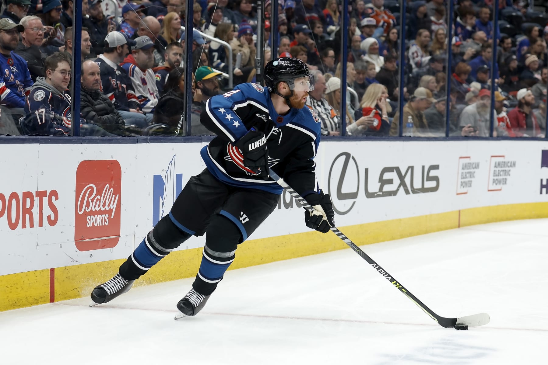 COLUMBUS, OH - JANUARY 16:  Vladislav Gavrikov #4 of the Columbus Blue Jackets controls the puck during the game against the New York Rangers at Nationwide Arena on January 16, 2023 in Columbus, Ohio. New York defeated Columbus 3-1. (Photo by Kirk Irwin/Getty Images)