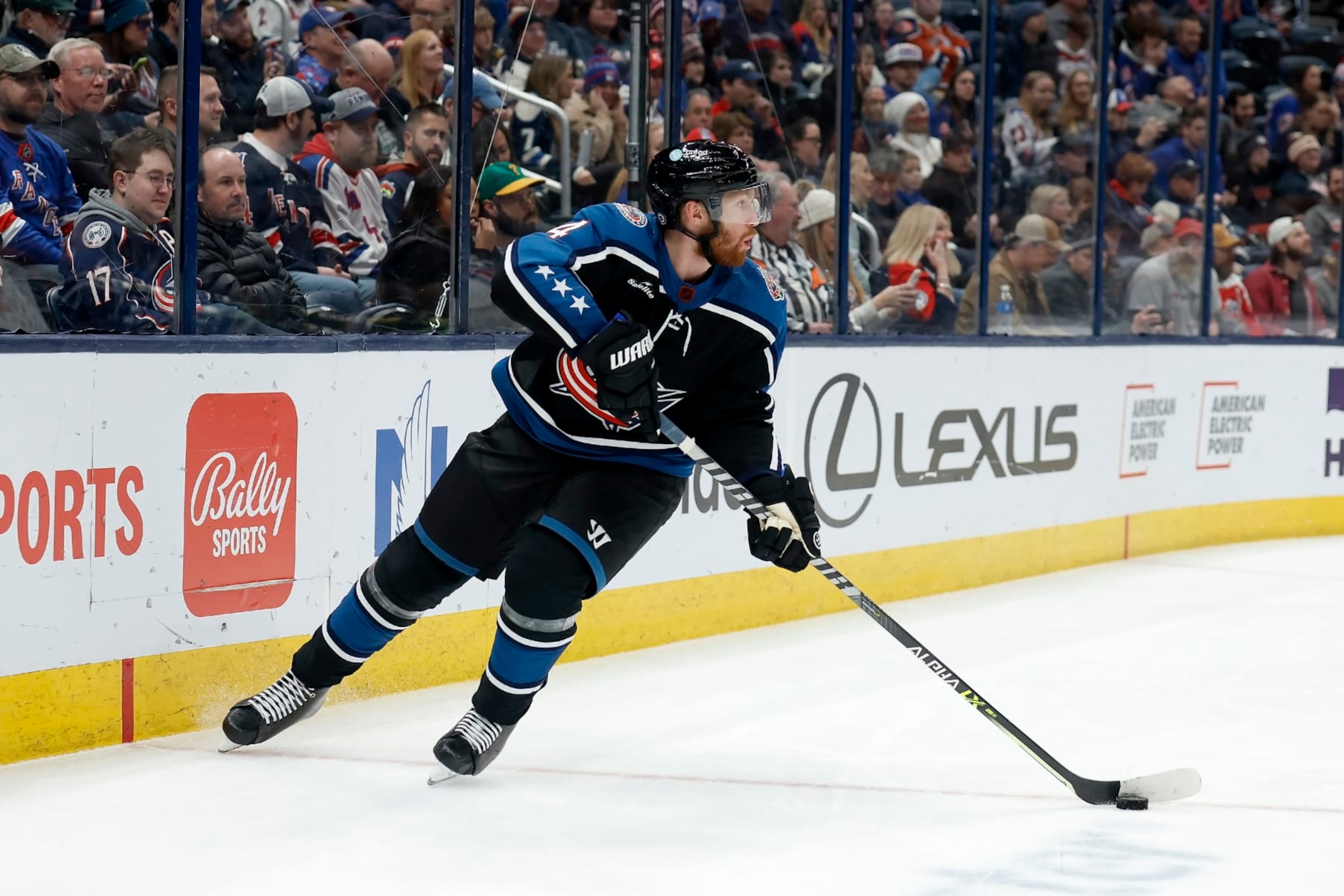 COLUMBUS, OH - JANUARY 16:  Vladislav Gavrikov #4 of the Columbus Blue Jackets controls the puck during the game against the New York Rangers at Nationwide Arena on January 16, 2023 in Columbus, Ohio. New York defeated Columbus 3-1. (Photo by Kirk Irwin/Getty Images)
