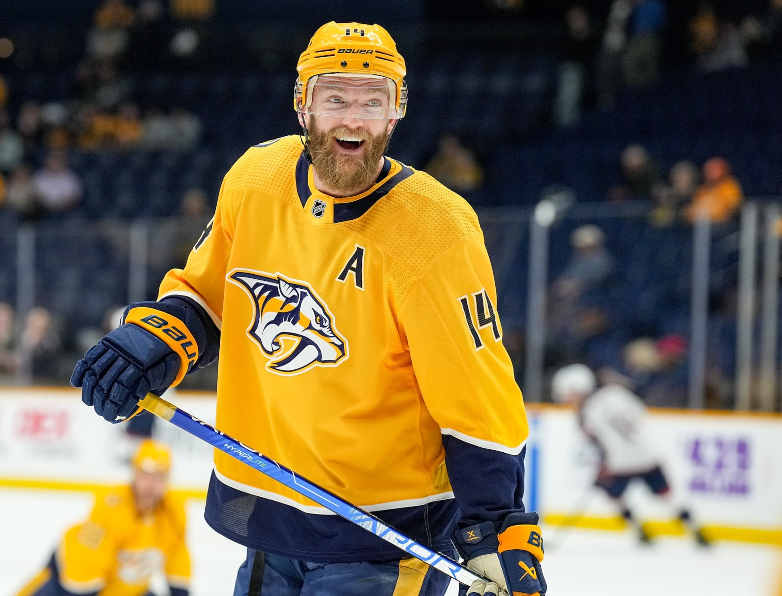 NASHVILLE, TENNESSEE - JANUARY 17: Mattias Ekholm #14 of the Nashville Predators smiles as he warms up against the Columbus Blue Jackets during an NHL game at Bridgestone Arena on January 17, 2023 in Nashville, Tennessee. (Photo by John Russell/NHLI via Getty Images)