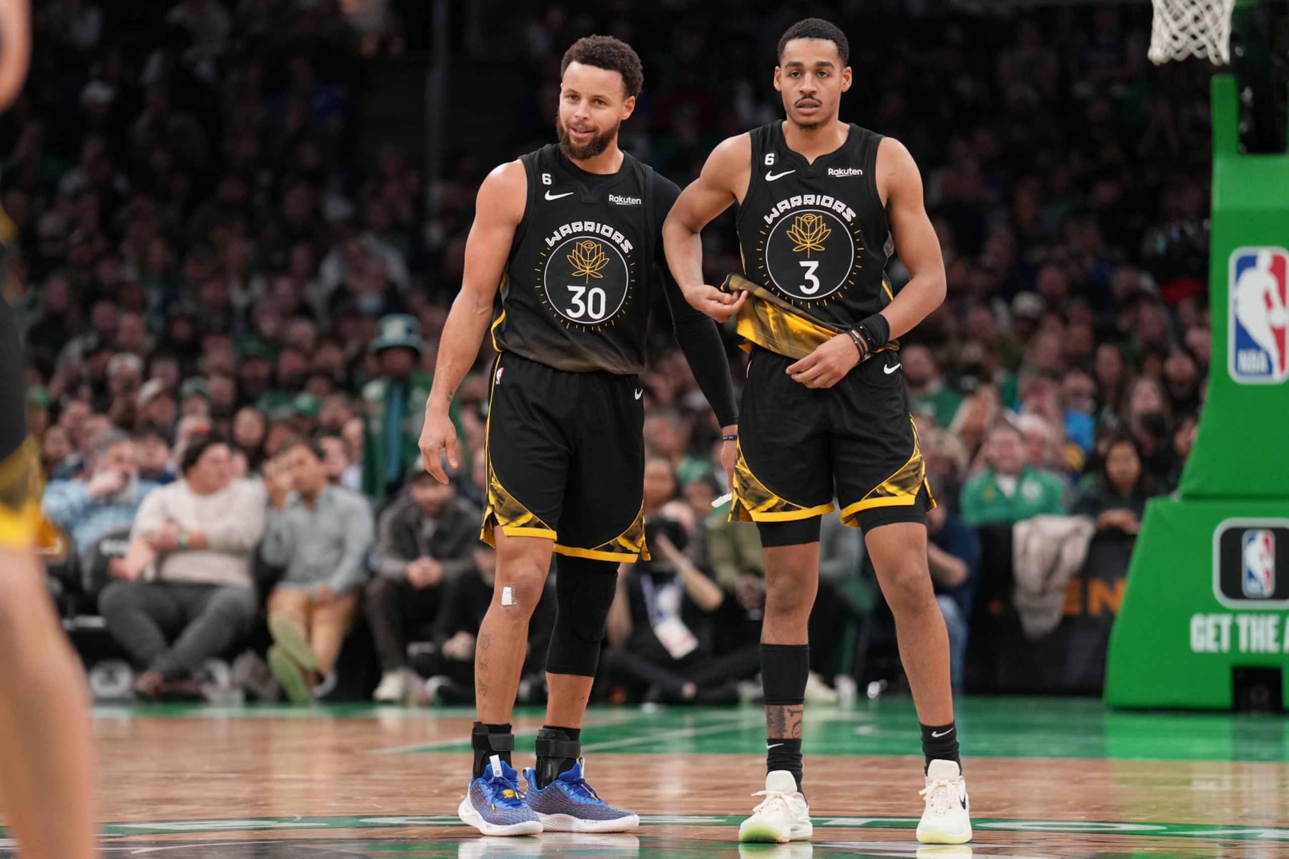 BOSTON, MA - JANUARY 19: Stephen Curry #30 of the Golden State Warriors talks with Jordan Poole #3 of the Golden State Warriors during the game against the Boston Celtics on January 19, 2023 at the TD Garden in Boston, Massachusetts. NOTE TO USER: User expressly acknowledges and agrees that, by downloading and or using this photograph, User is consenting to the terms and conditions of the Getty Images License Agreement. Mandatory Copyright Notice: Copyright 2023 NBAE  (Photo by Jesse D. Garrabrant/NBAE via Getty Images)