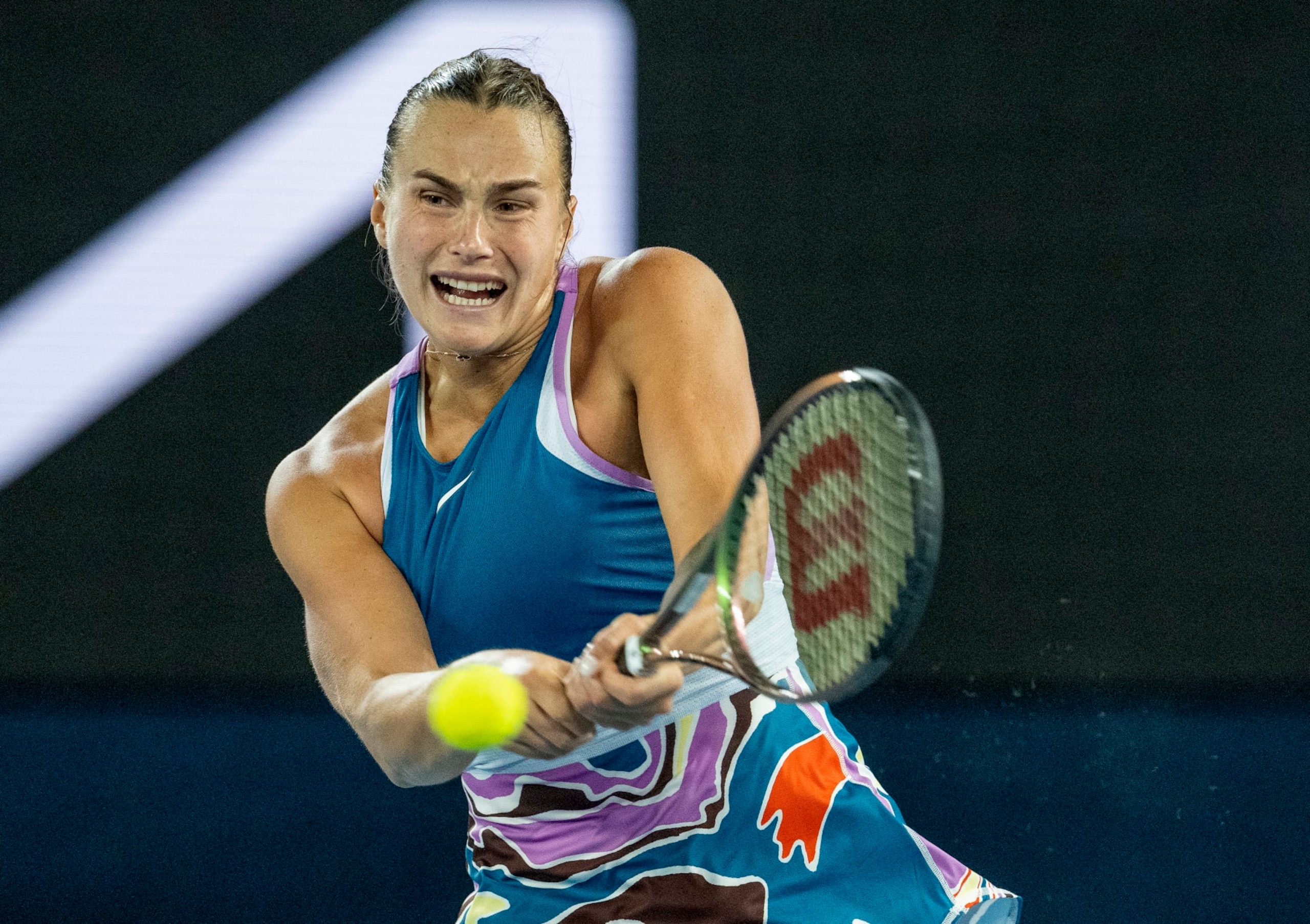 MELBOURNE, AUSTRALIA - JANUARY 26: Aryna Sabalenka plays a backhand in the Semifinal singles match against Magda Linette of Poland during day eleven of the 2023 Australian Open at Melbourne Park on January 26, 2023 in Melbourne, Australia. (Photo by Will Murray/Getty Images) MELBOURNE, AUSTRALIA - JANUARY 26: Aryna Sabalenka plays a backhand in the Semifinal singles match against Magda Linette of Poland during day eleven of the 2023 Australian Open at Melbourne Park on January 26, 2023 in Melbourne, Australia. (Photo by Will Murray/Getty Images)