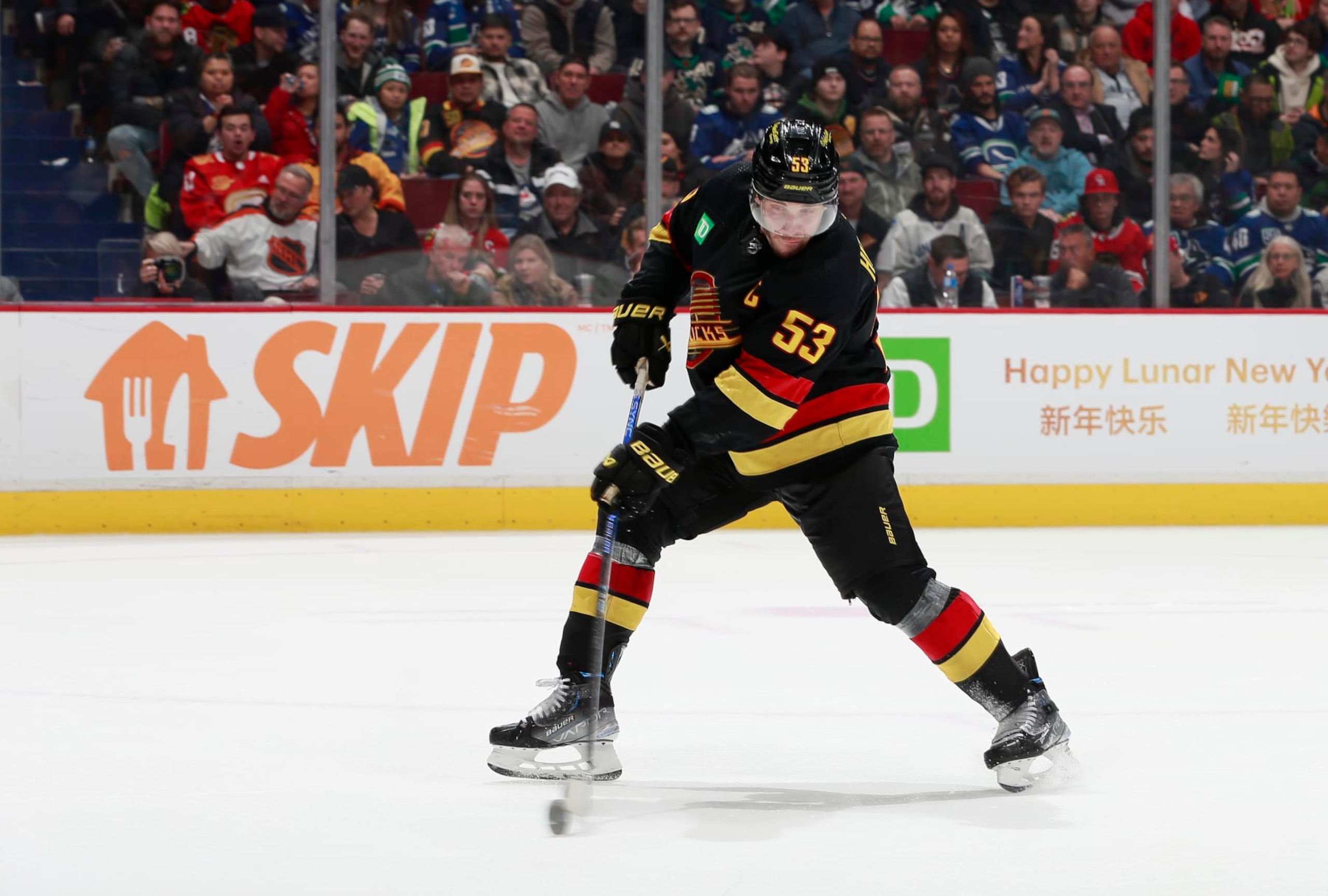 VANCOUVER, CANADA - JANUARY 24: Bo Horvat #53 of the Vancouver Canucks scores goal 5 during the third period of their NHL game at Rogers Arena January 24, 2023 in Vancouver, British Columbia, Canada. The Vancouver Canucks win 5-2.(Photo by Jeff Vinnick/NHLI via Getty Images)