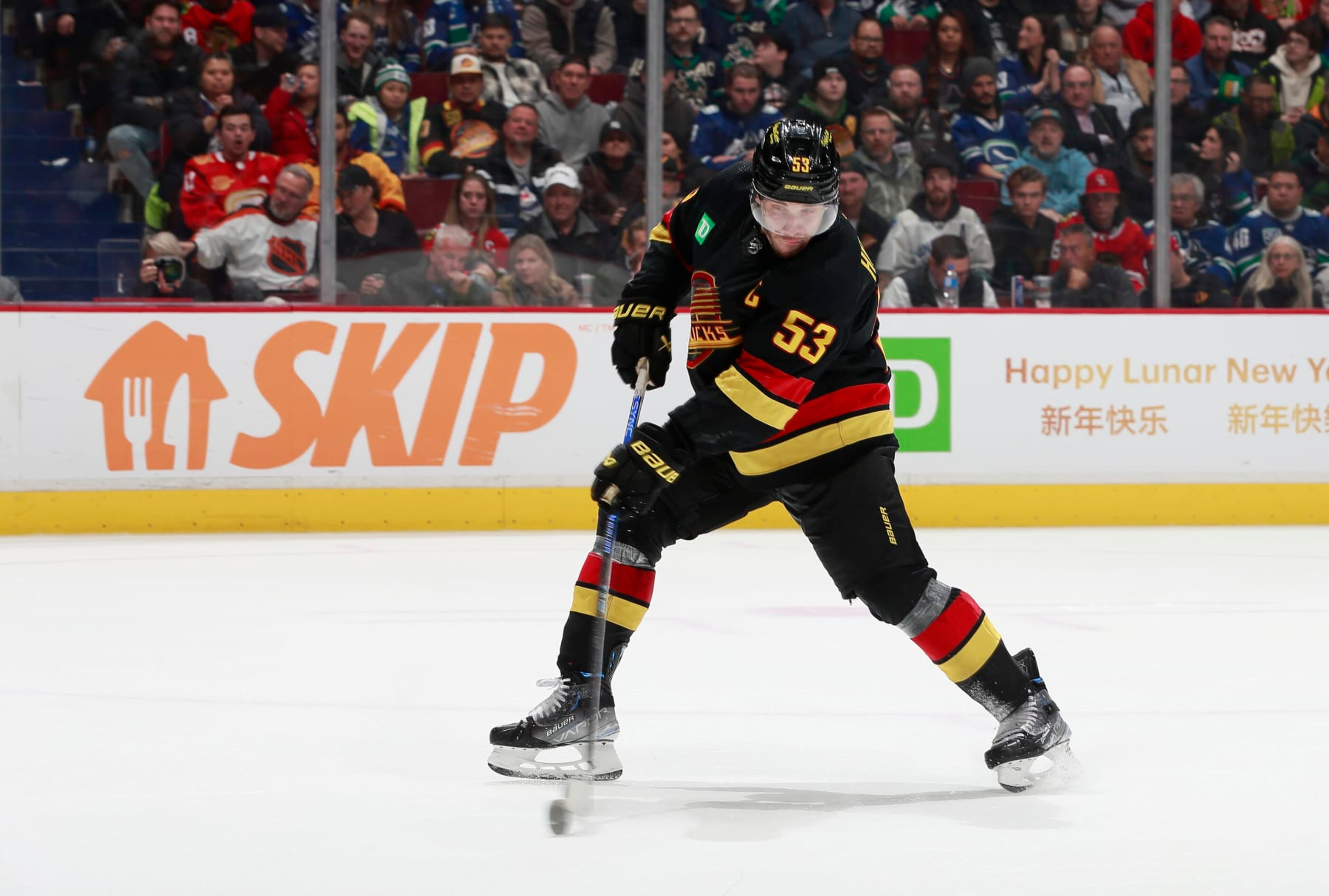 VANCOUVER, CANADA - JANUARY 24: Bo Horvat #53 of the Vancouver Canucks scores goal 5 during the third period of their NHL game at Rogers Arena January 24, 2023 in Vancouver, British Columbia, Canada. The Vancouver Canucks win 5-2.(Photo by Jeff Vinnick/NHLI via Getty Images)