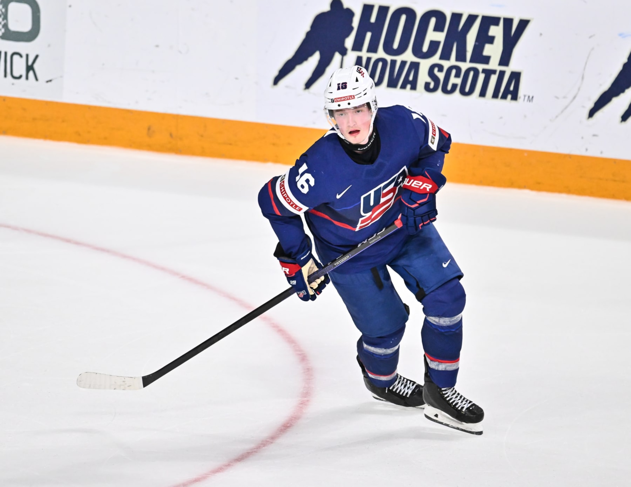 HALIFAX, CANADA - JANUARY 04:  Chaz Lucius #16 of Team United States skates against Team Canada during the third period in the semifinal round of the 2023 IIHF World Junior Championship at Scotiabank Centre on January 4, 2023 in Halifax, Nova Scotia, Canada.  Team Canada defeated Team United States 6-2.  (Photo by Minas Panagiotakis/Getty Images)